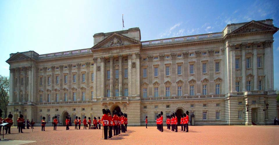 Band performing during The Changing of the Guard ceremony taking place in the courtyard of Buckingham Palace