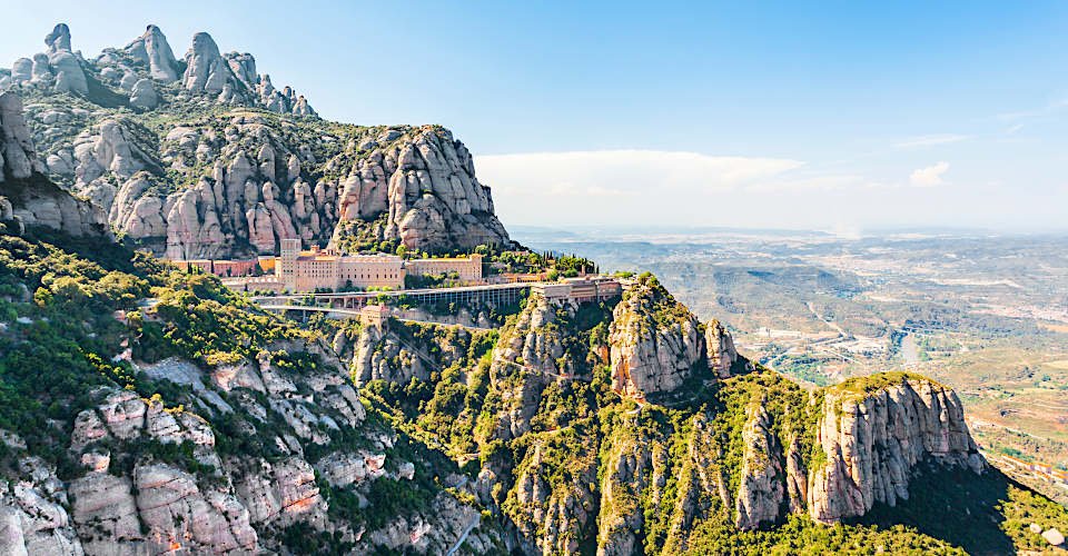 View of the Monastery of Montserrat in Catalonia, near Barcelona. Panorama from the top of the mountain.