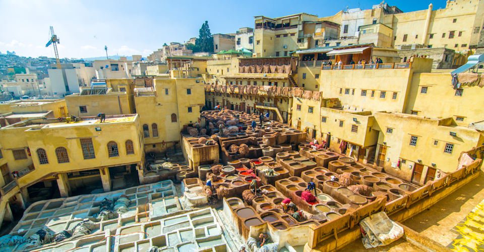 Fez/Morocco - February 22, 2018: Men working in the leather tanneries in Fez, Morocco.