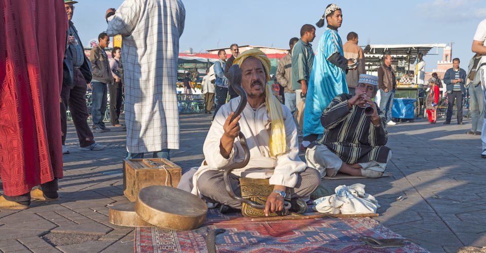 MARRAKESH, MOROCCO - NOV 22: Snake charmer at the Jemaa el-Fnaa square in Marrakesh. November 22, 2008 in Marrakesh, Morocco