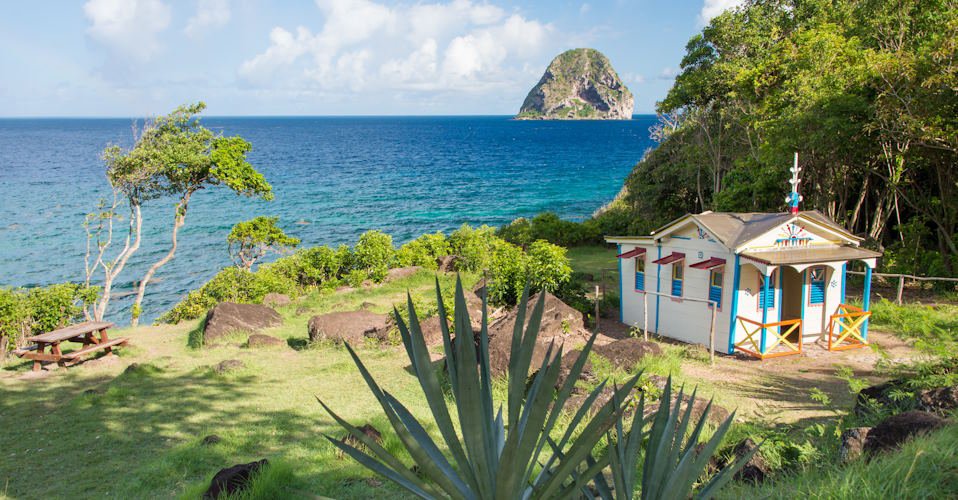 Le Diamant, Martinique, France - 26 July 2017: Maison du Bagnard at Le Diamant in Martinique and Diamond Rock in the distance