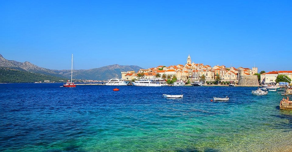 Clear water at the waterfront of Korcula town Croatia. Korcula is a historic fortified town on the protected east coast of the island of Korcula