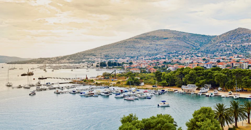 Trogir is a historic UNESCO town and harbour on the Adriatic coast and a popular tourist destination