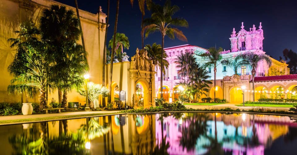 The El Prado Restaurant and Lily Pond at night in Balboa Park, San Diego, California.