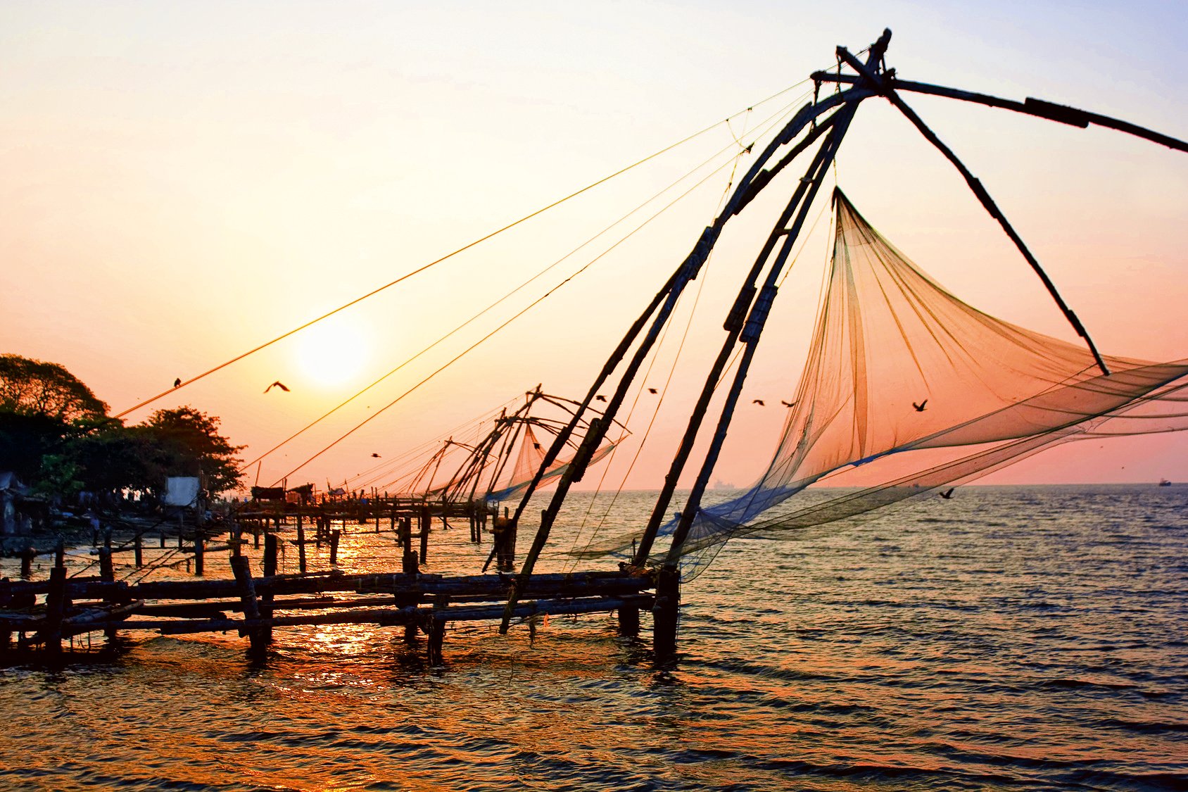 Sunset with Chinese fishing net in Cochin, Kerala, India 