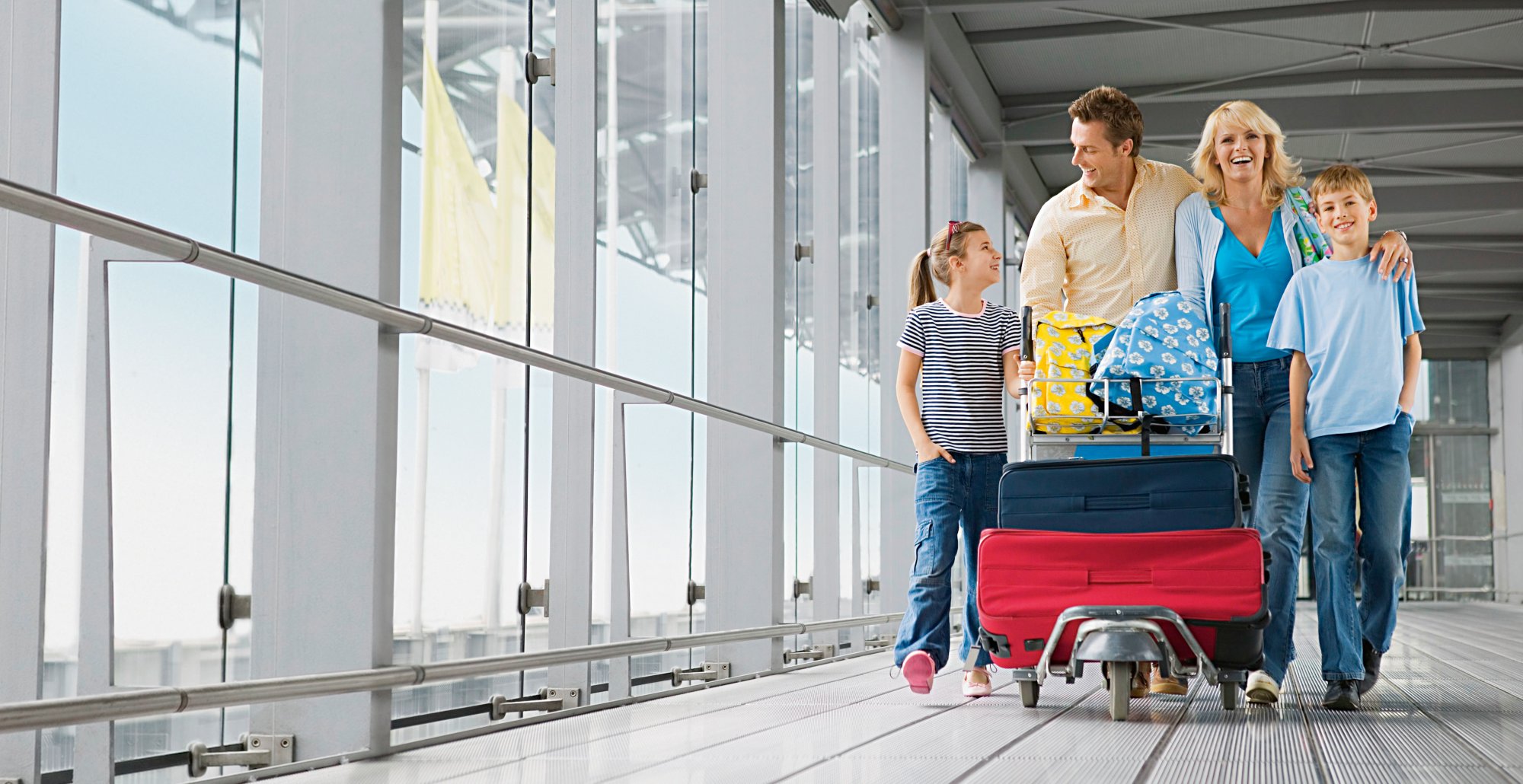 Family with suitcases in an airport