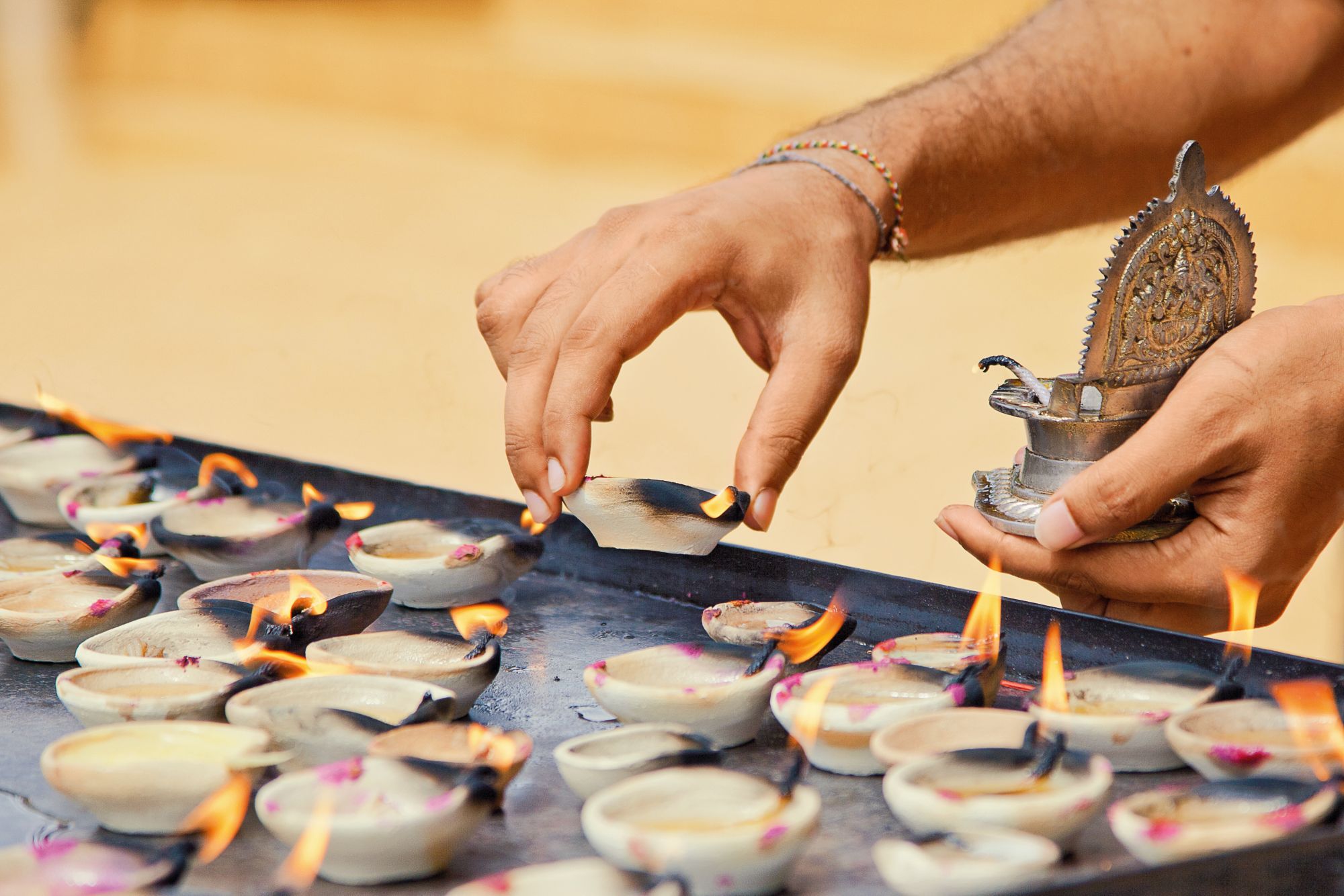 Lighting up the candles in the hindu temple
