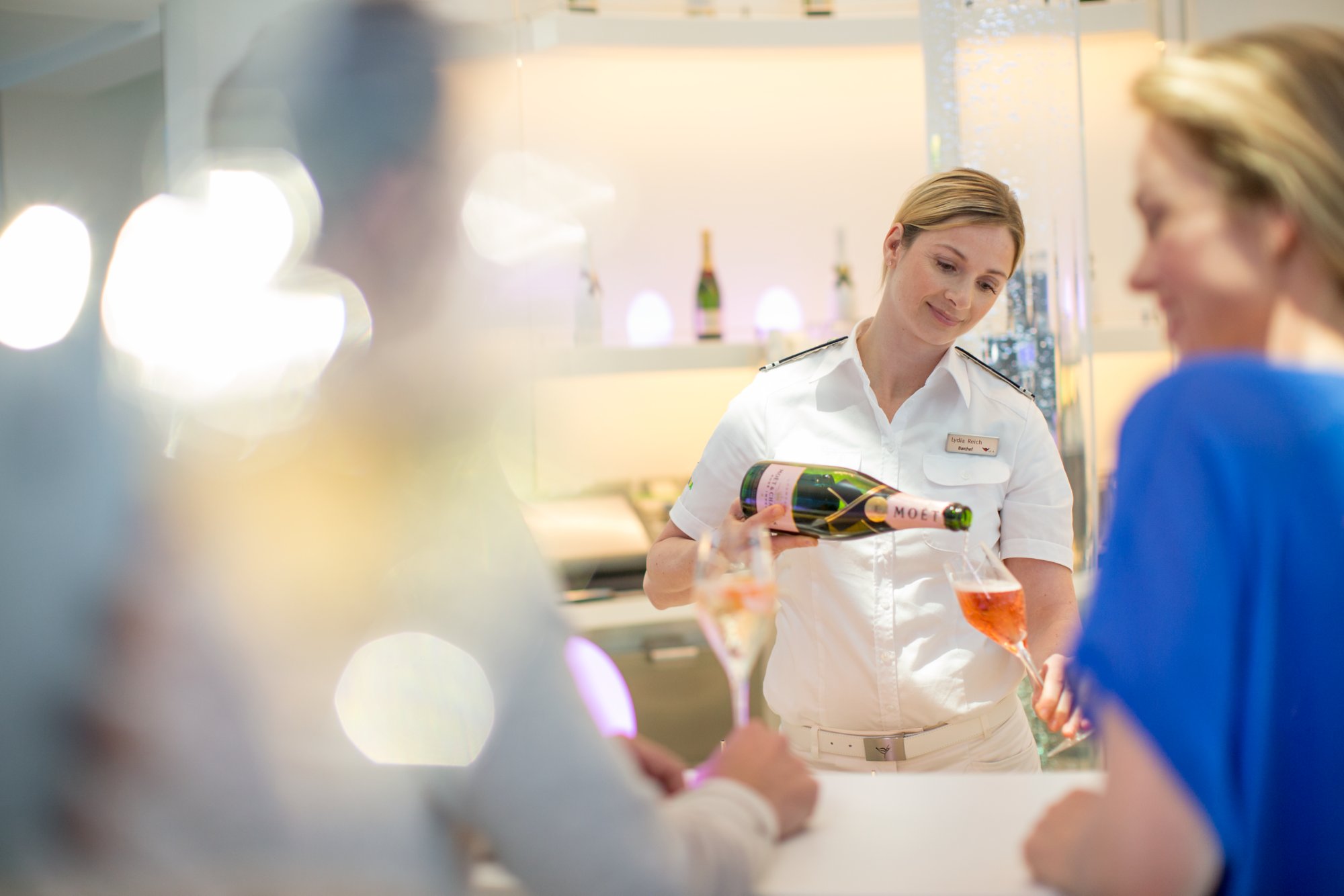 Bar manager serving drinks