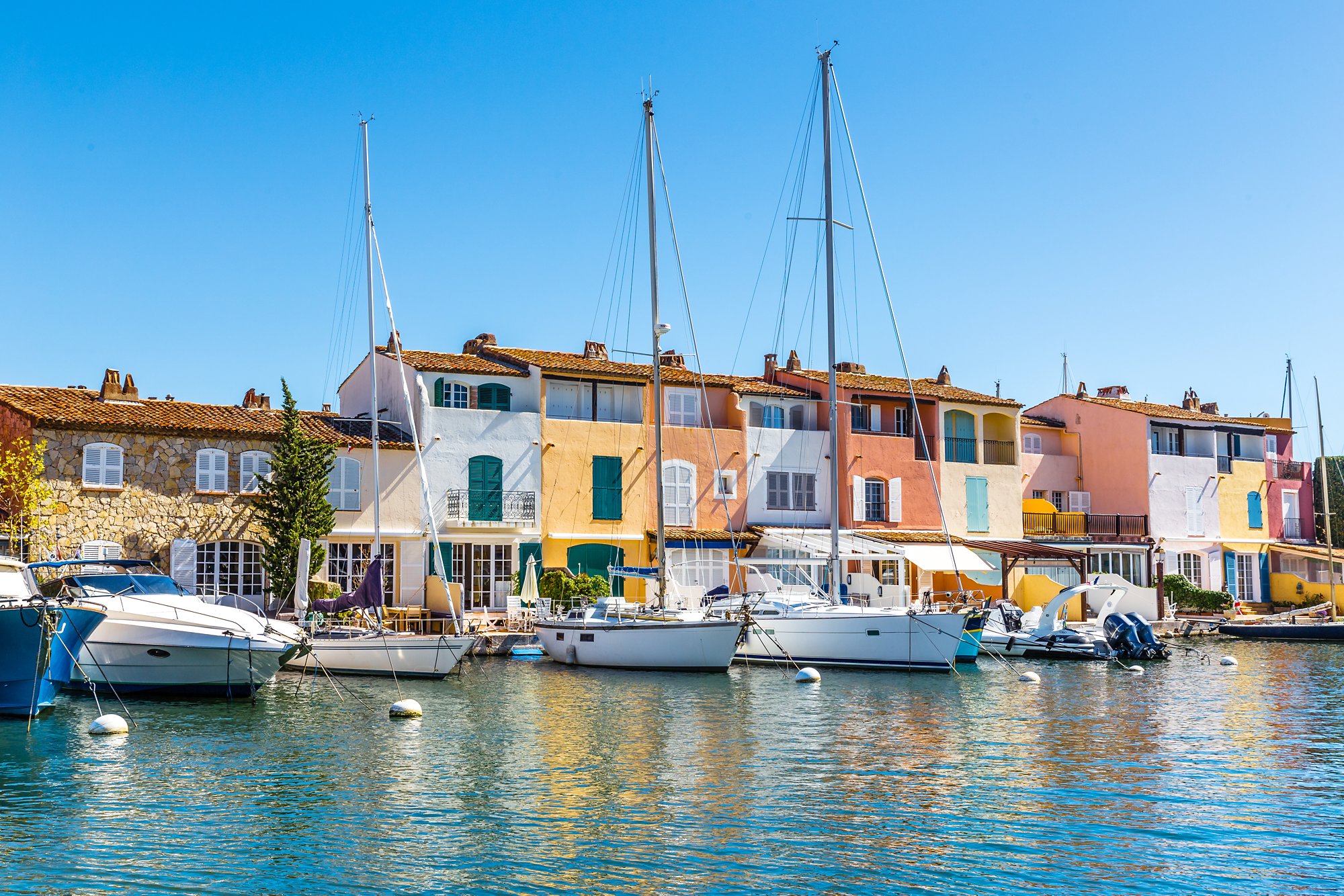 View Of Colorful Houses And Boats In Port Grimaud During Summer Day-Port Grimaud, France
