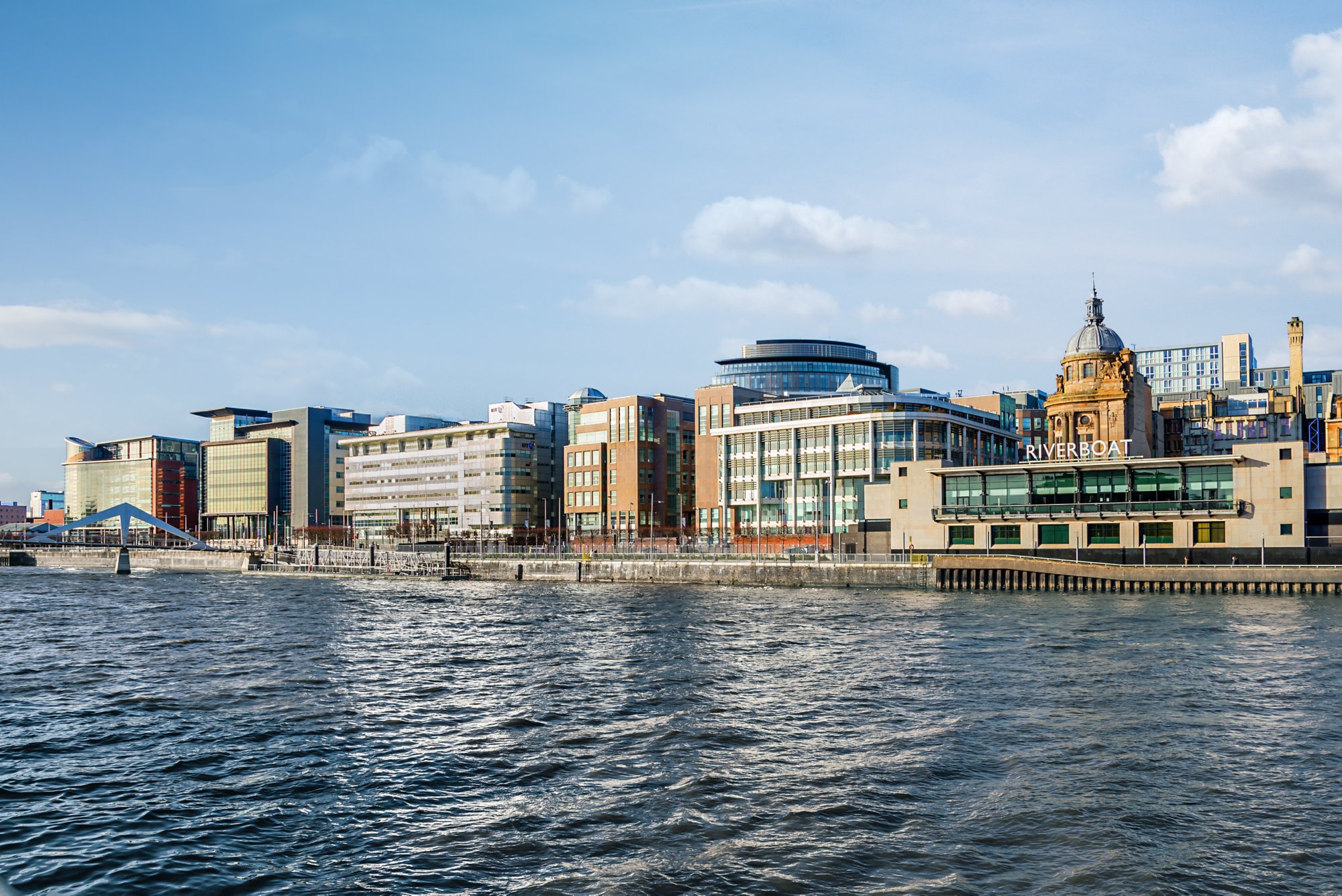 GLASGOW, SCOTLAND – MARCH 08: Modern office buildings on banks of the River Clyde at Atlantic Quay on March 08, 2015 in Glasgow, Scotland.