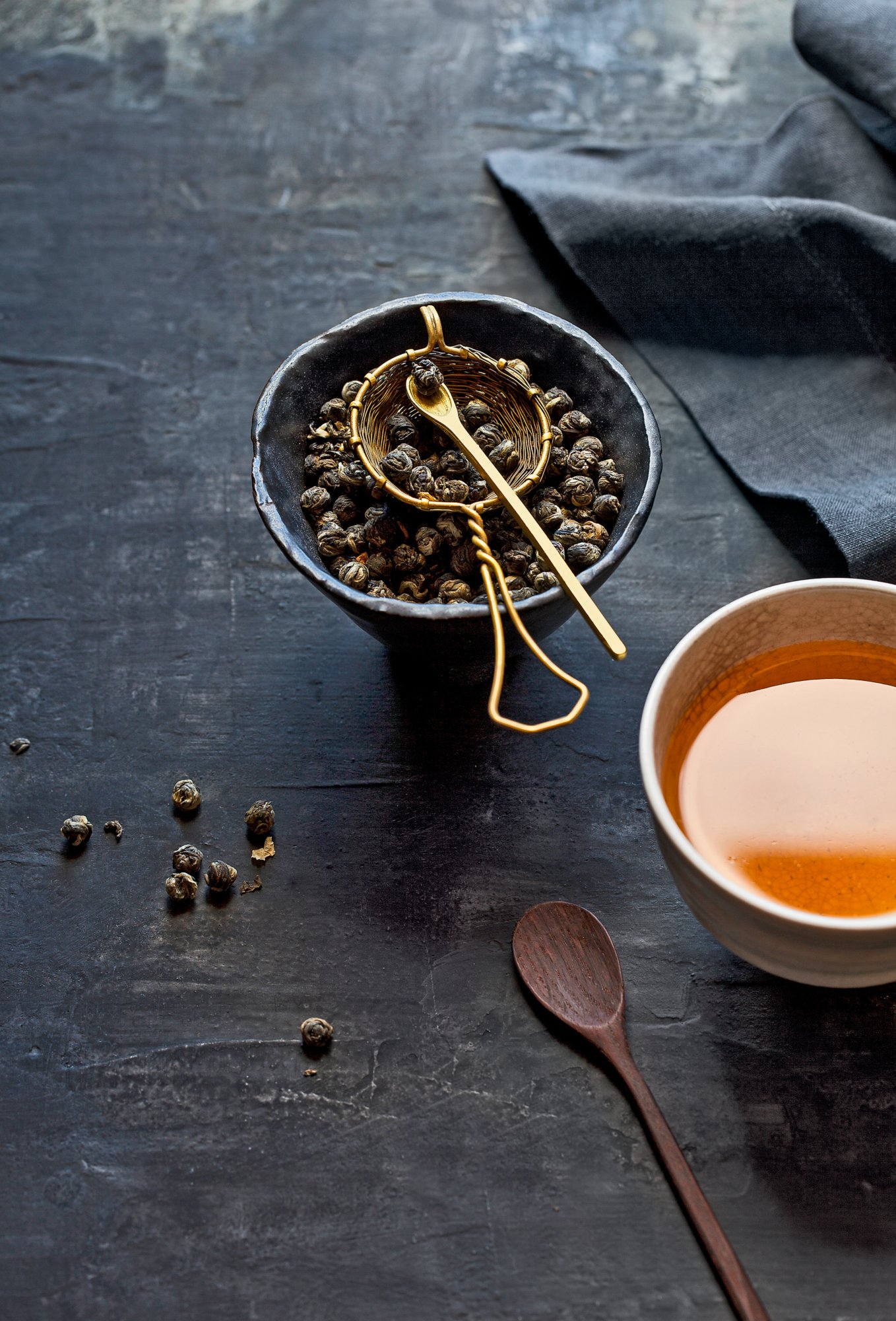 Chinese green tea arranged on a dark background