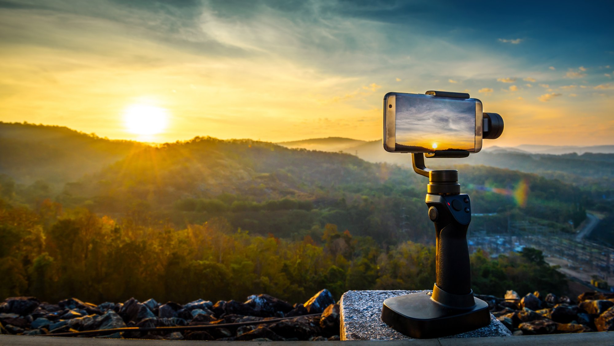 Close-up Smartphone take a Mountians Landscape photo and video timelapse on stand  Mobile Stabilizer in sunset; Shutterstock ID 559439296; Purchase Order: -