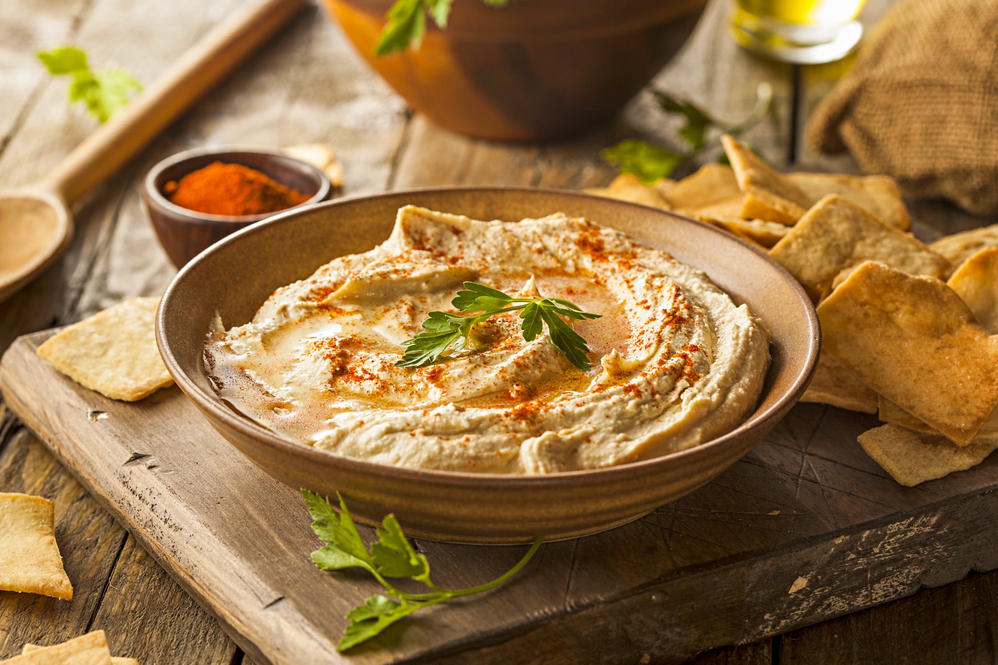 Healthy Homemade Creamy Hummus with Olive Oil and Pita Chips