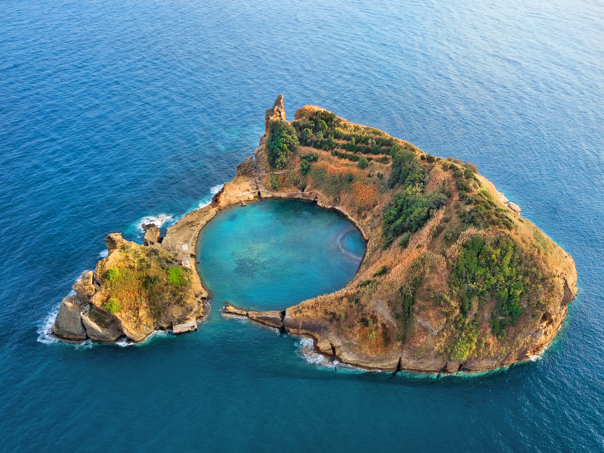 Top view of Islet of Vila Franca do Campo is formed by the crater of an old underwater volcano near San Miguel island, Azores, Portugal. Bird eye view, aerial panoramic view.