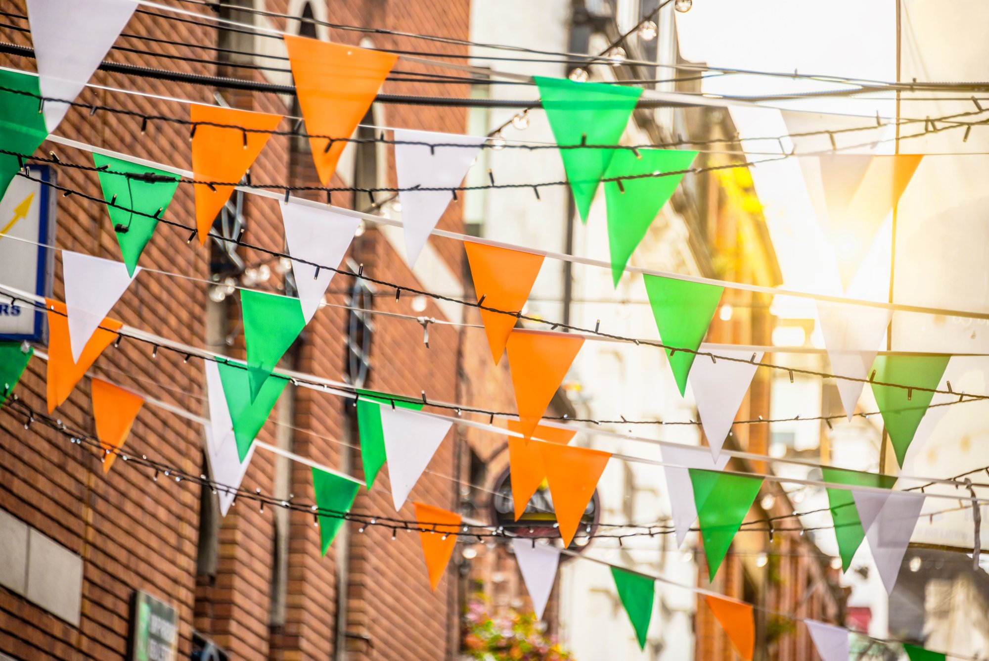 Garland with irish flag colors in a street of Dublin, Ireland - Saint Patrick day celebration concept