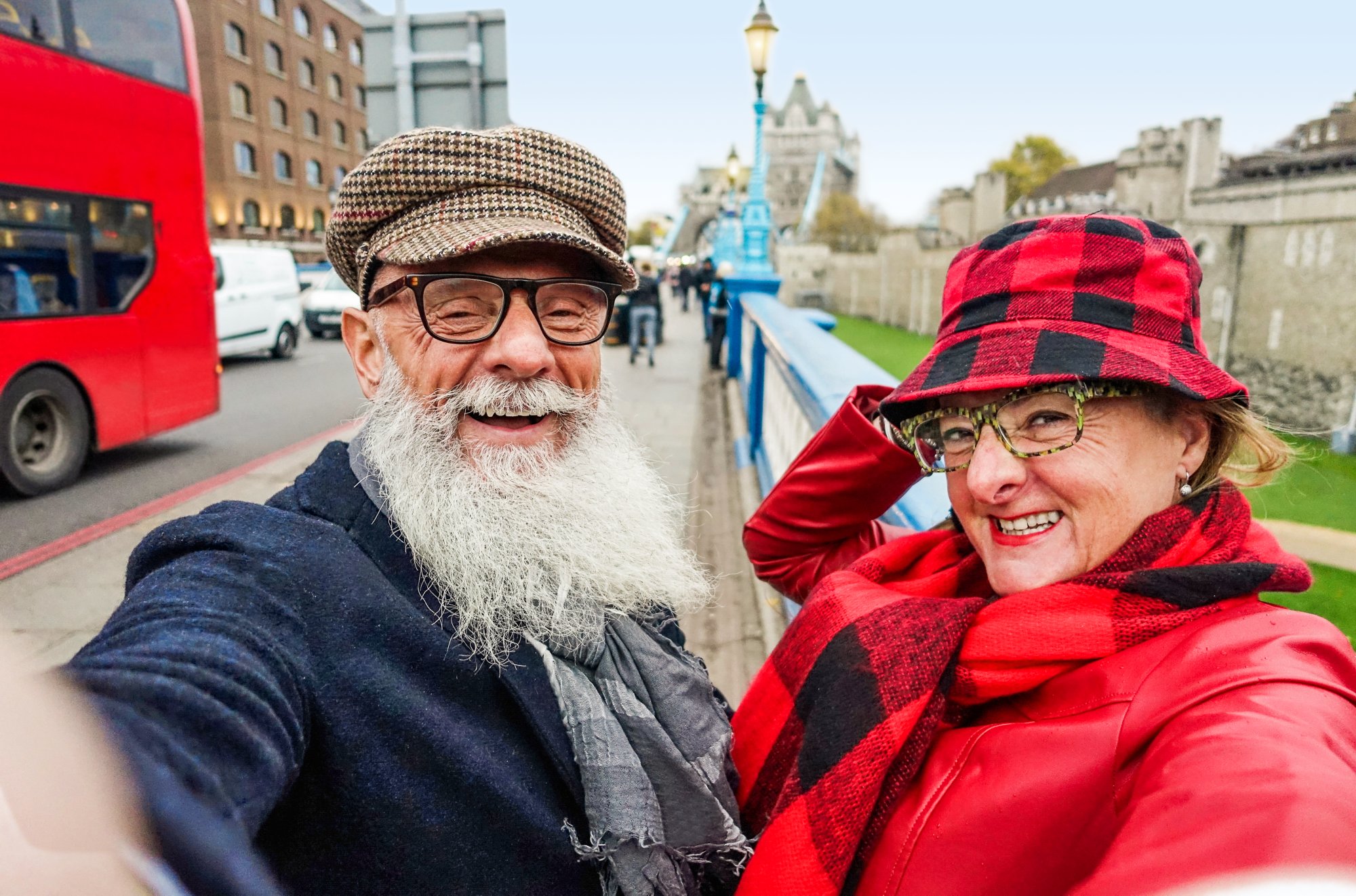 Happy senior couple taking selfie in london - Old trendy people having fun with technology trends - Travel and joyful elderly lifestyle concept - Main focus on man face