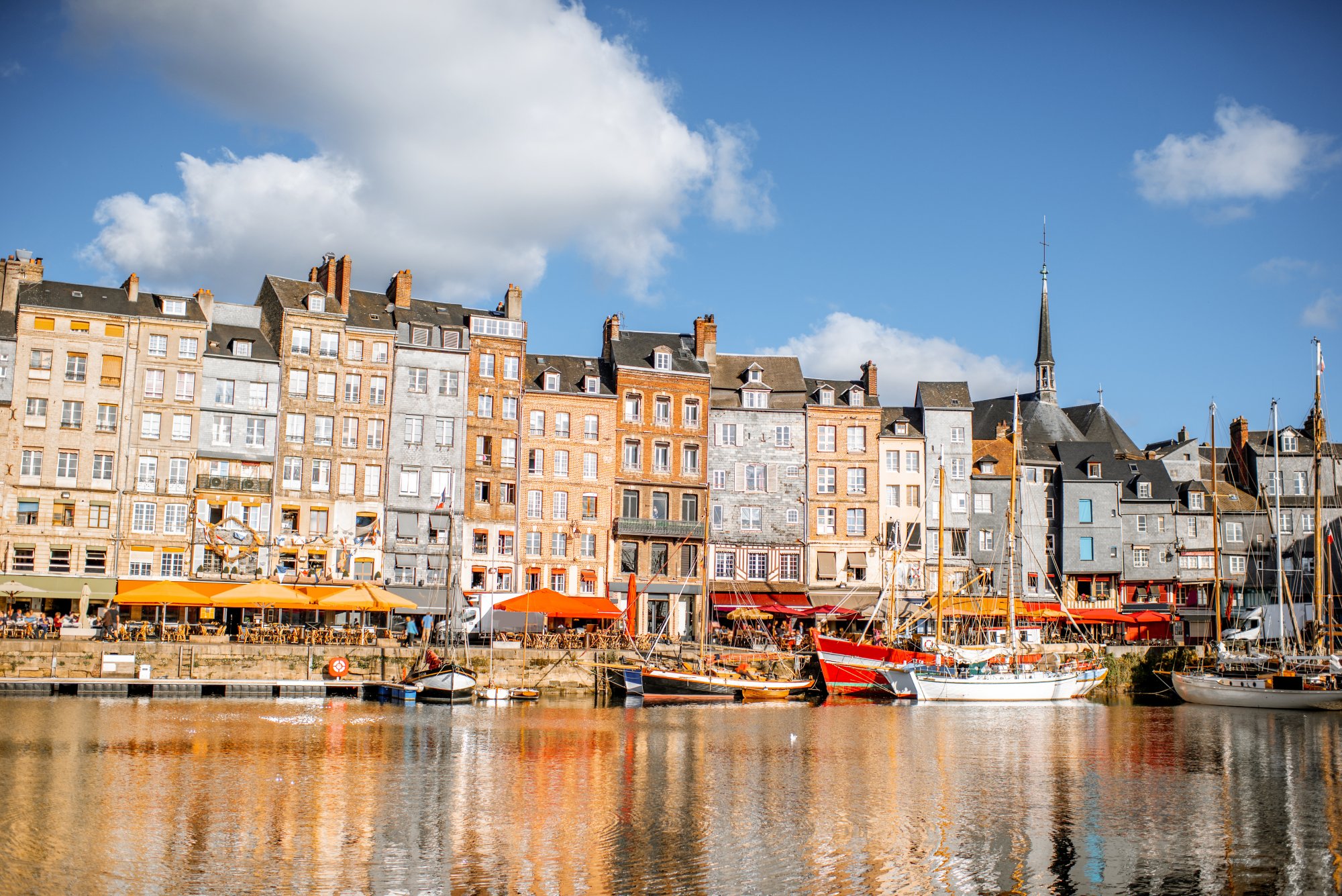 Landscape view of the harbour in Honfleur, famous french town in Normandy, during the morning light