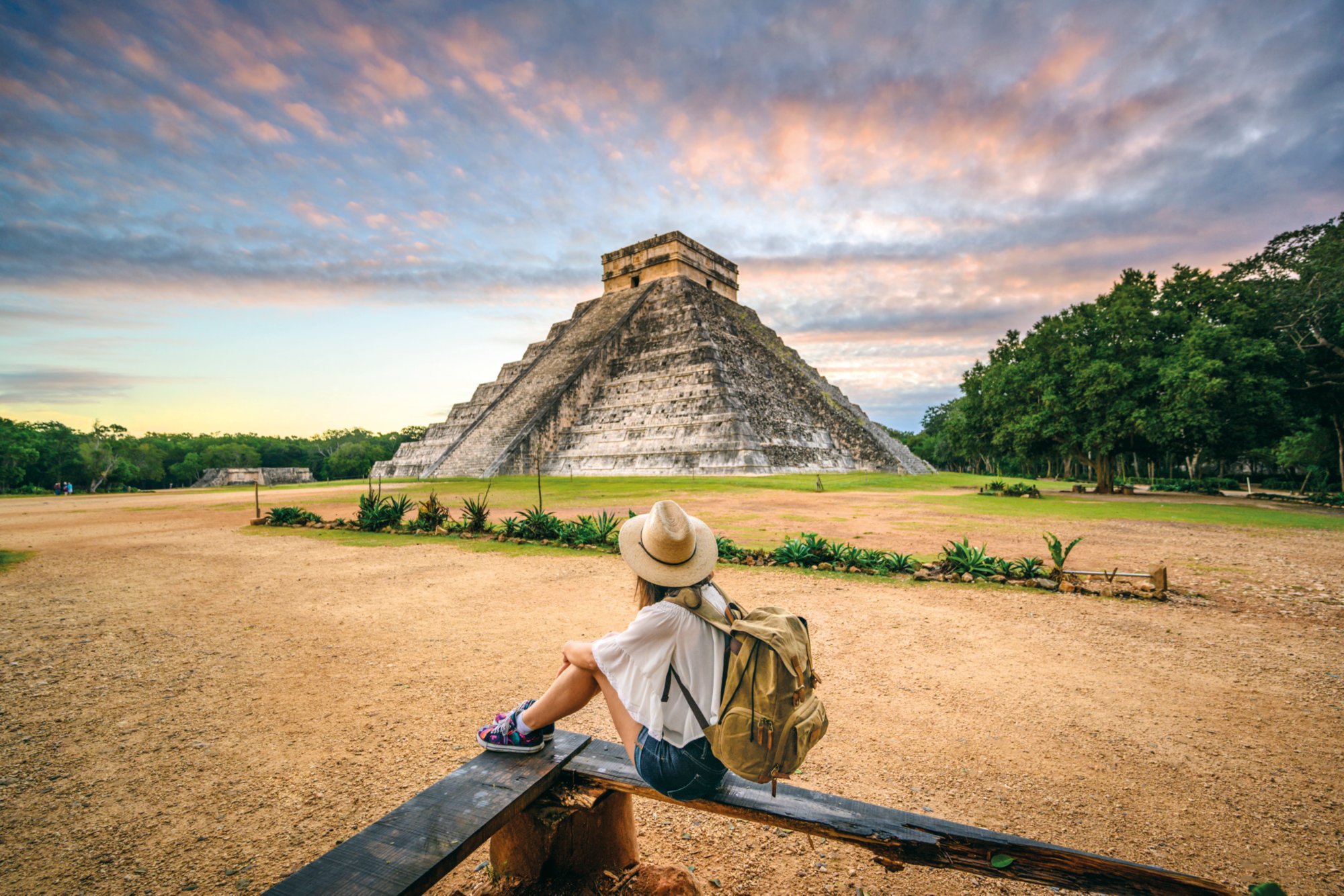 One woman admiring Kukulkan pyramid at Chichen-Itza archaeological site, Yucatan, Mexico