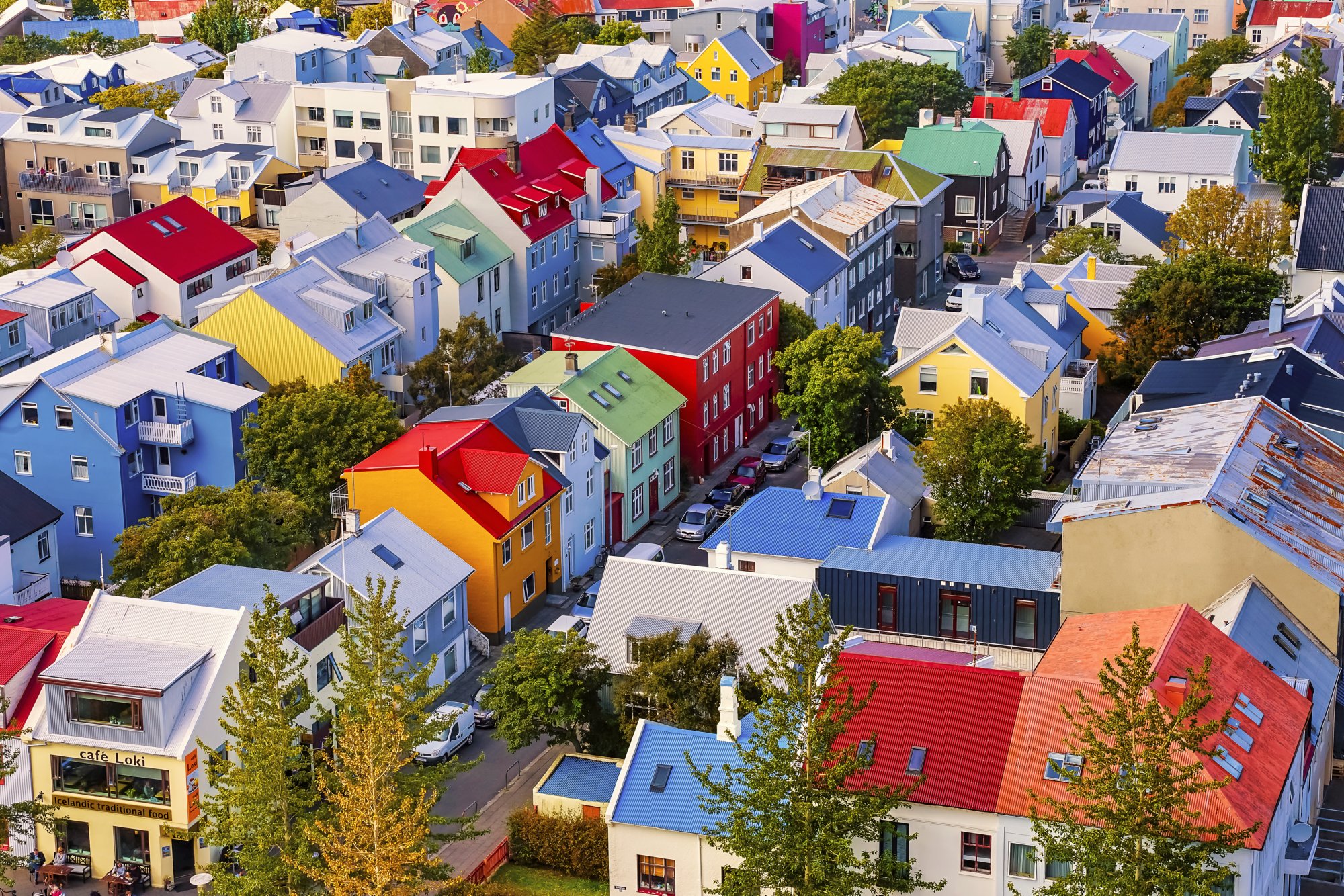 Colorful Red Green Blue Yellow Houses Cars Streets Reykjavik Iceland.  Most houses are made of corrugated metal.