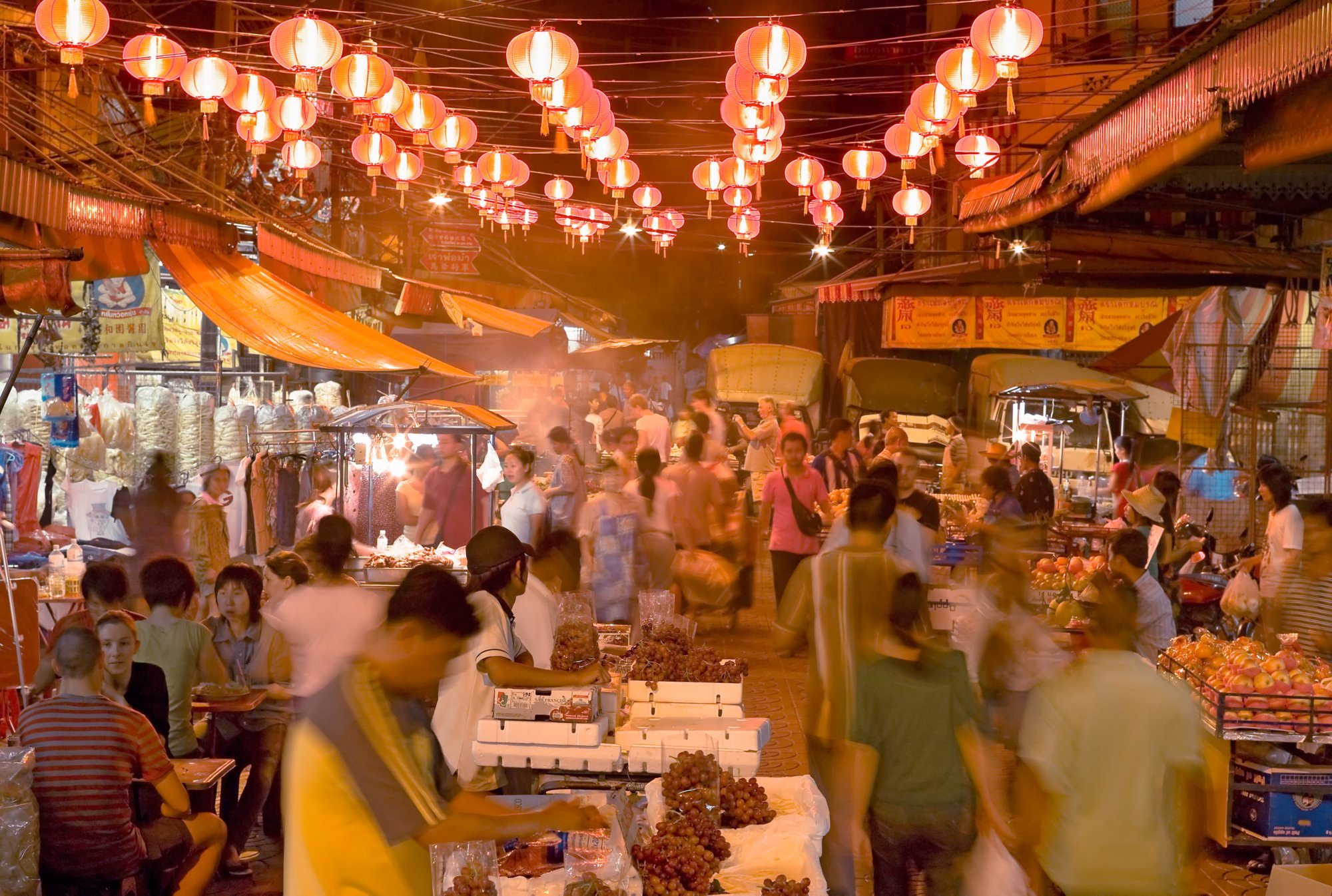 Chinese New Year. food - night Market, with lanterns, decorated street, crowds of people.