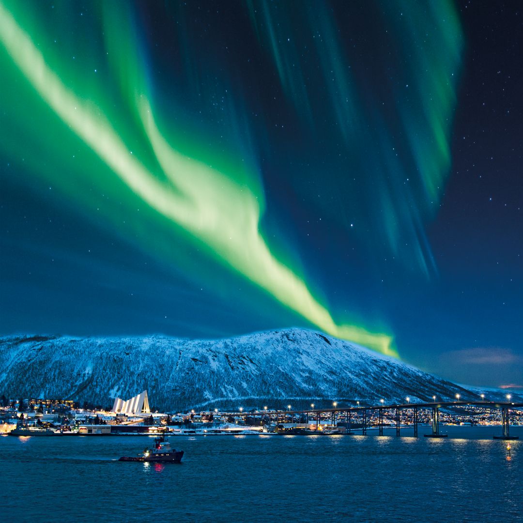 Aurora borealis over Tromso port, Norway.