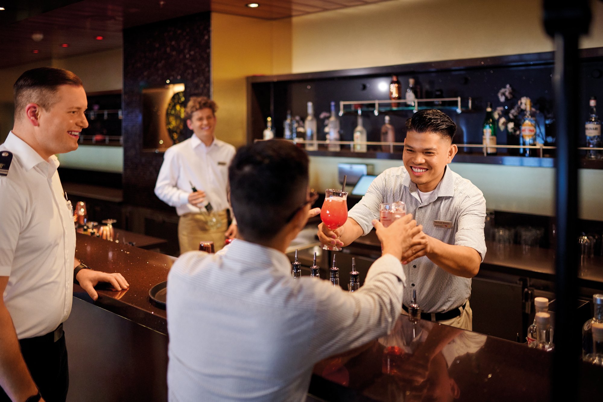 AIDA Barkeeper serves guests 