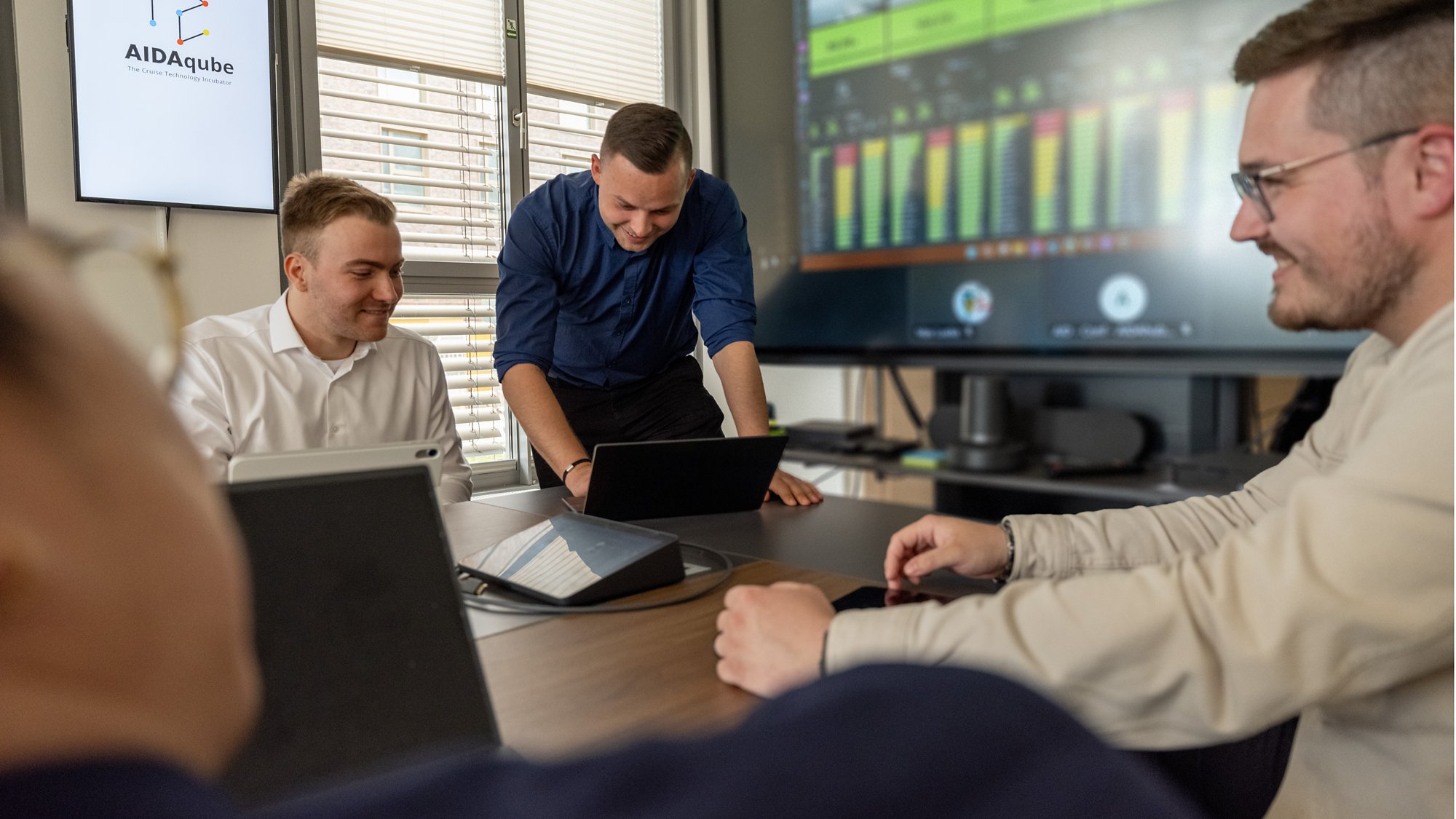 AIDA Mitarbeitende in einem Meeting