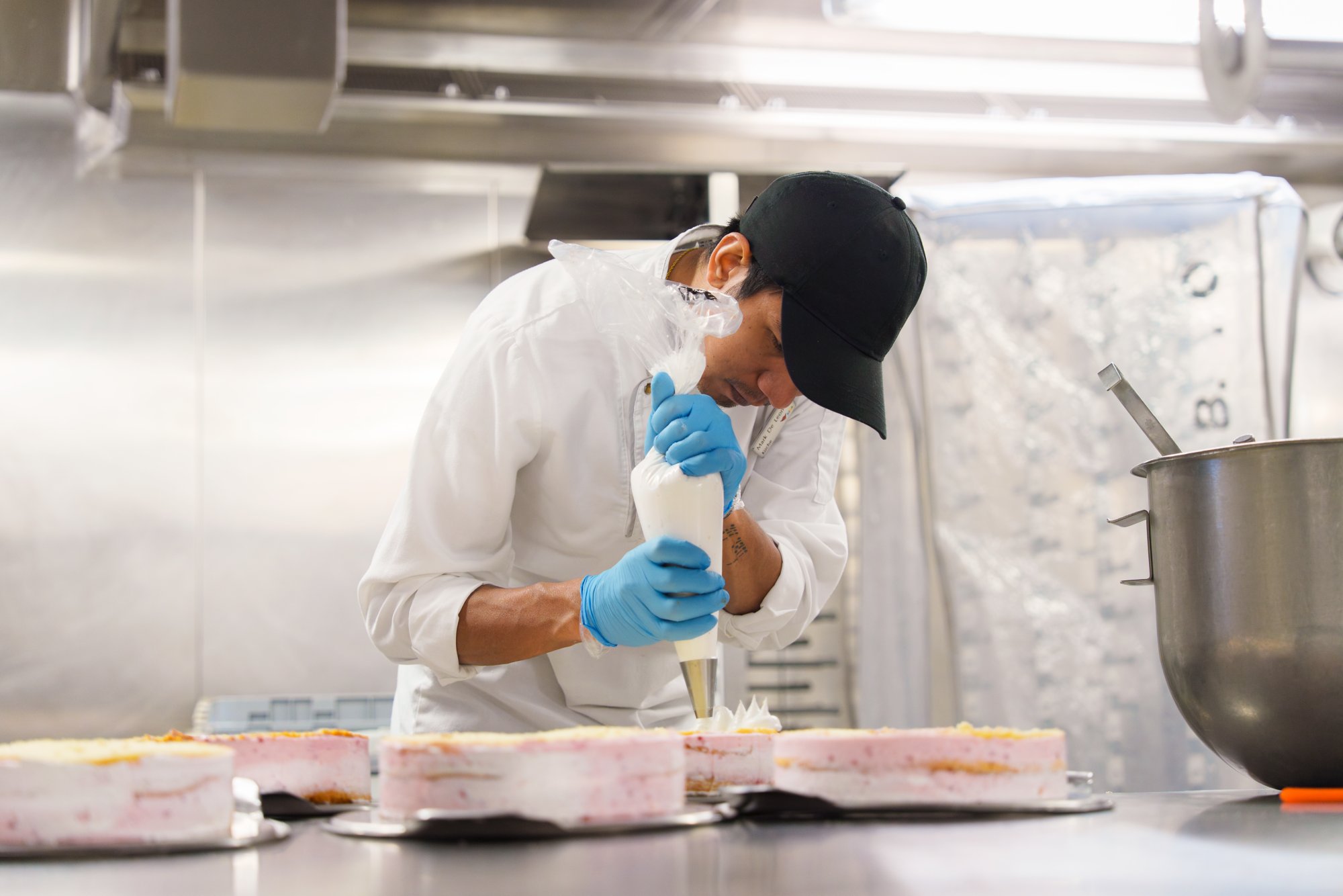 Chef in the AIDA Galley arranges plates