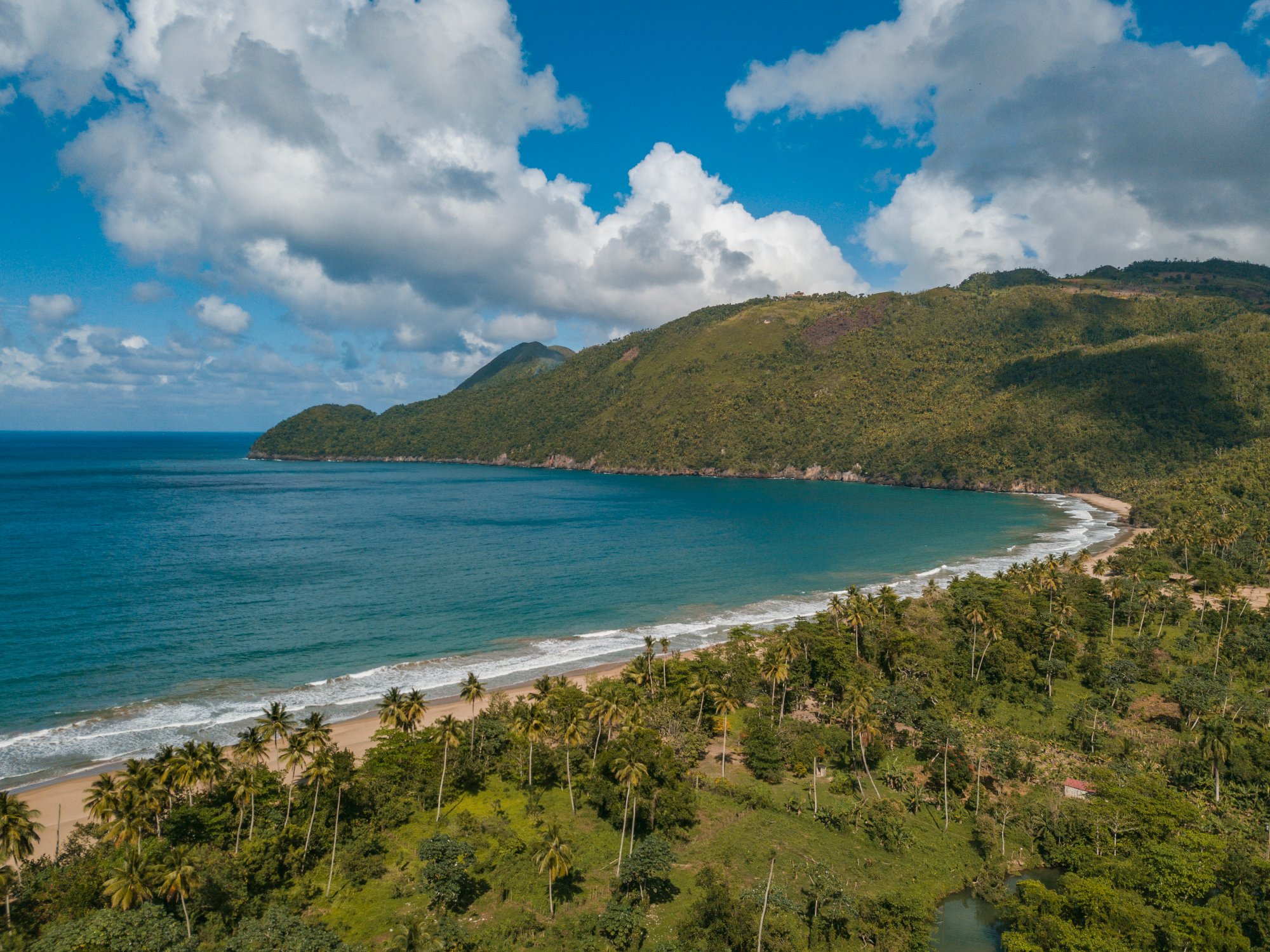 A landscape of El Valle Beach surrounded by greenery and sea in Samana, the Dominican Republic