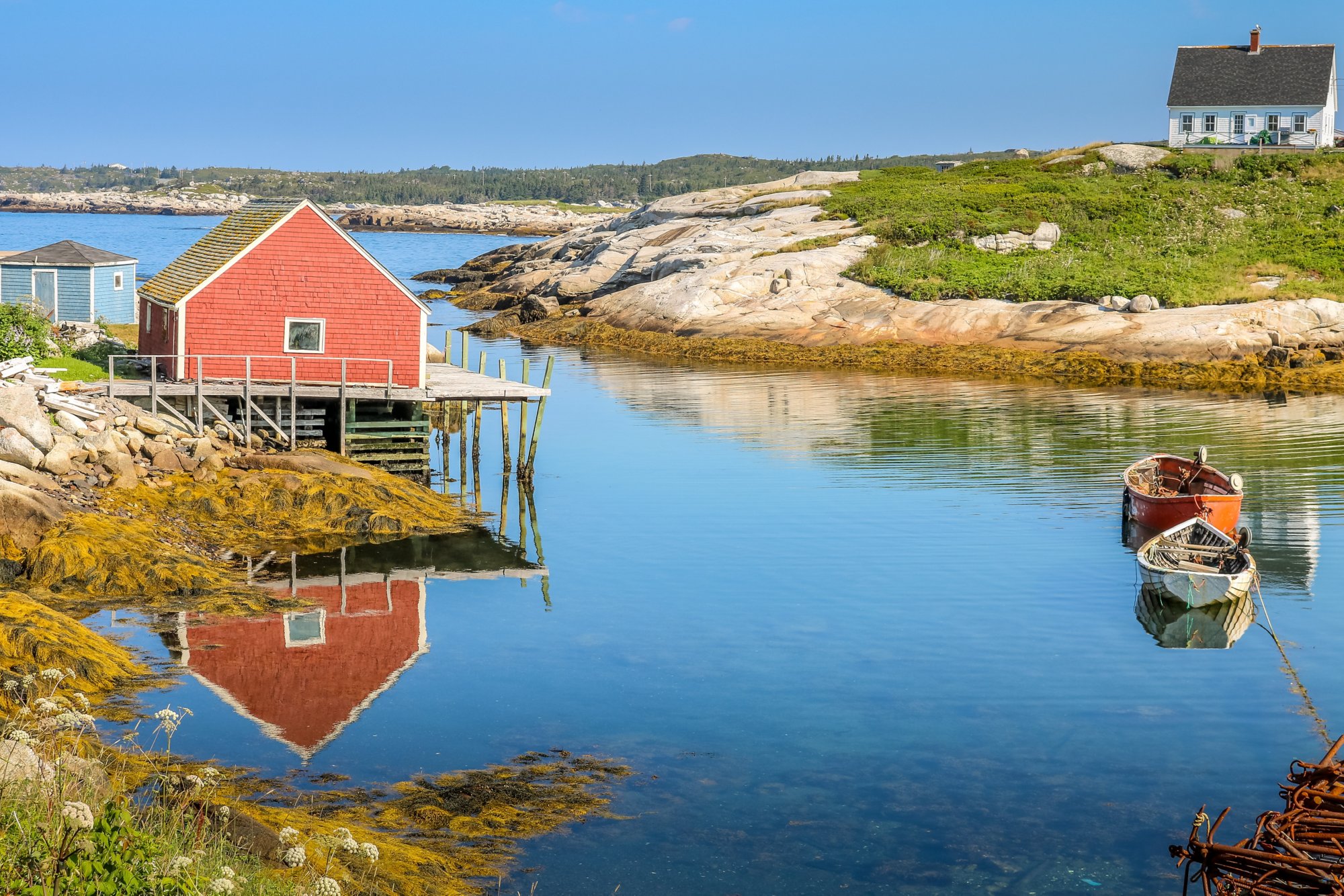 Landscape reflections of Peggys Cove village in Canada