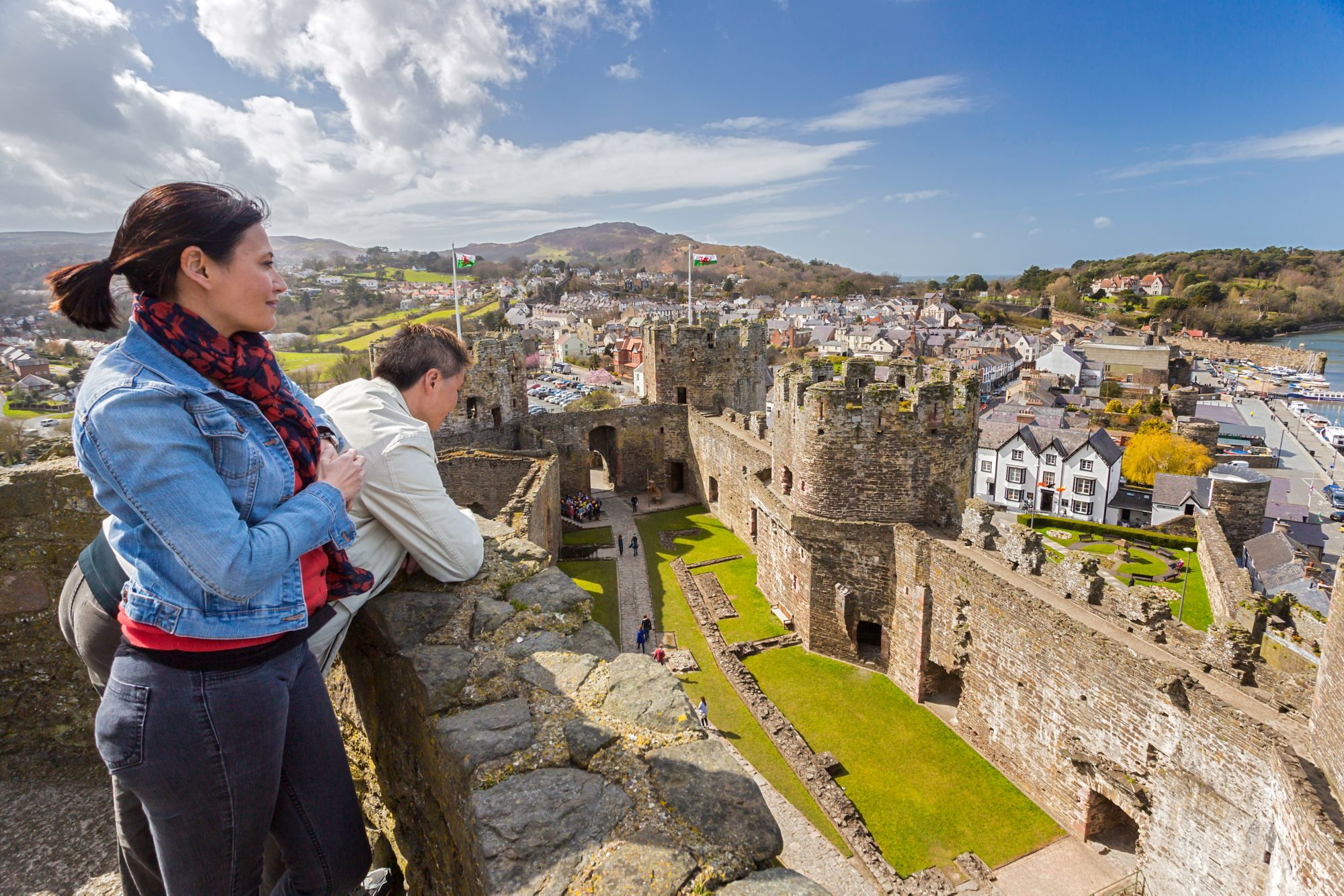 Couple visiting the castleConwy CastleCadw SitesWorld Heritage SitesSAMN: CN004NGR: SH783774ConwyNorthCastlesMedievalDefenceHistoric Sites