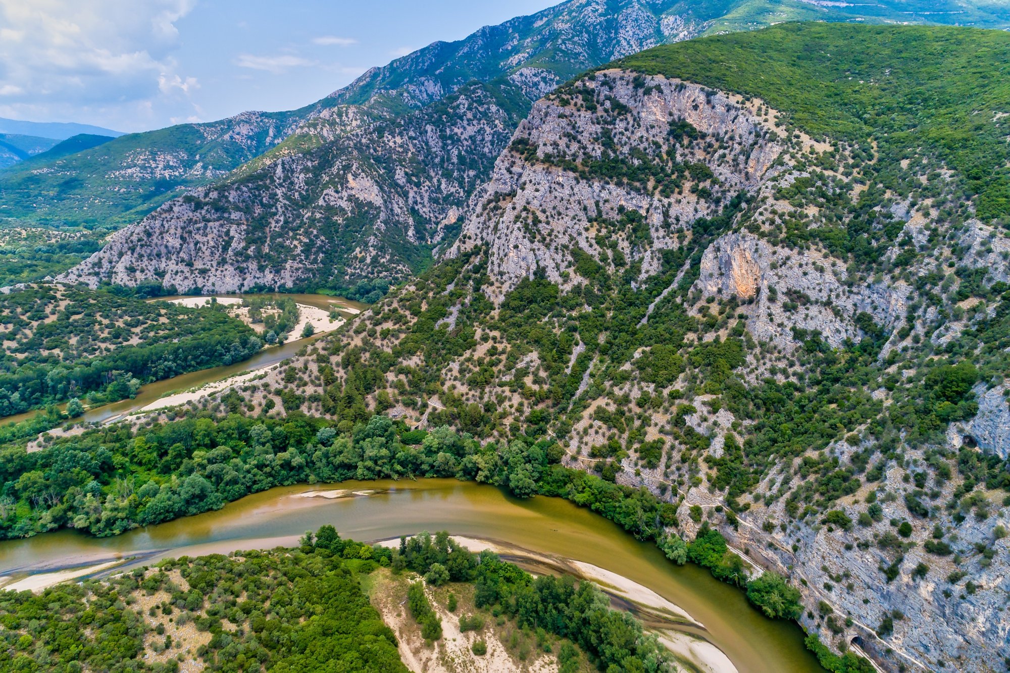 Aerial view of the river Nestos in Xanthi, Greece. The Nestos River forms on its long journey landscapes of unique beauty with rich forests, rare wetlands. favorite destination for canoe and kayak