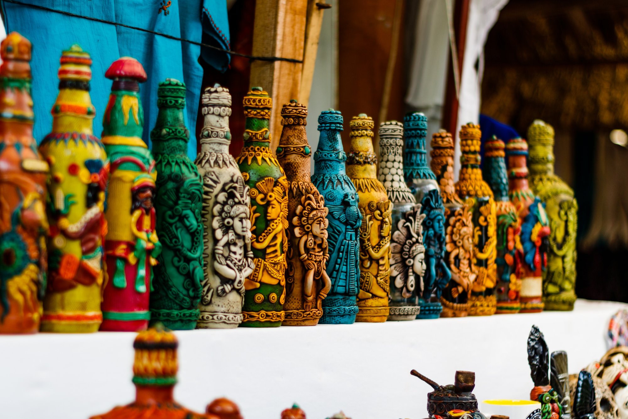 Puerto Quetzal, Guatemala - circa February 2018.  Decorative bottles on a shelf in Puerto Quetzal, Guatemala.  Hand made bottle designs.