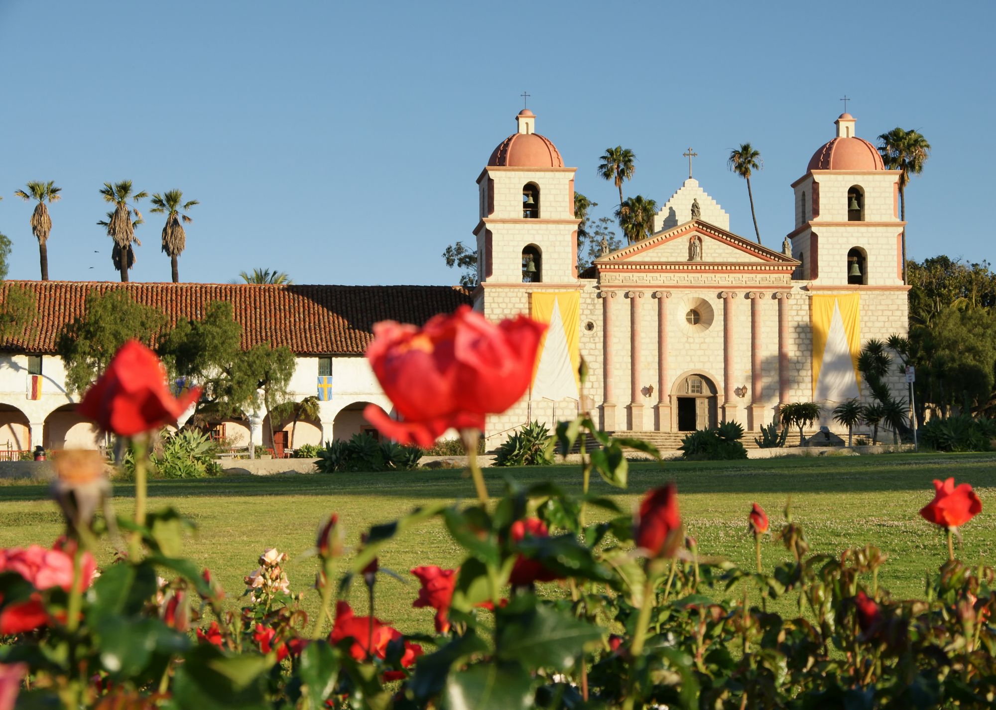 Mission in Santa Barbara USa with roses in front in April 2009