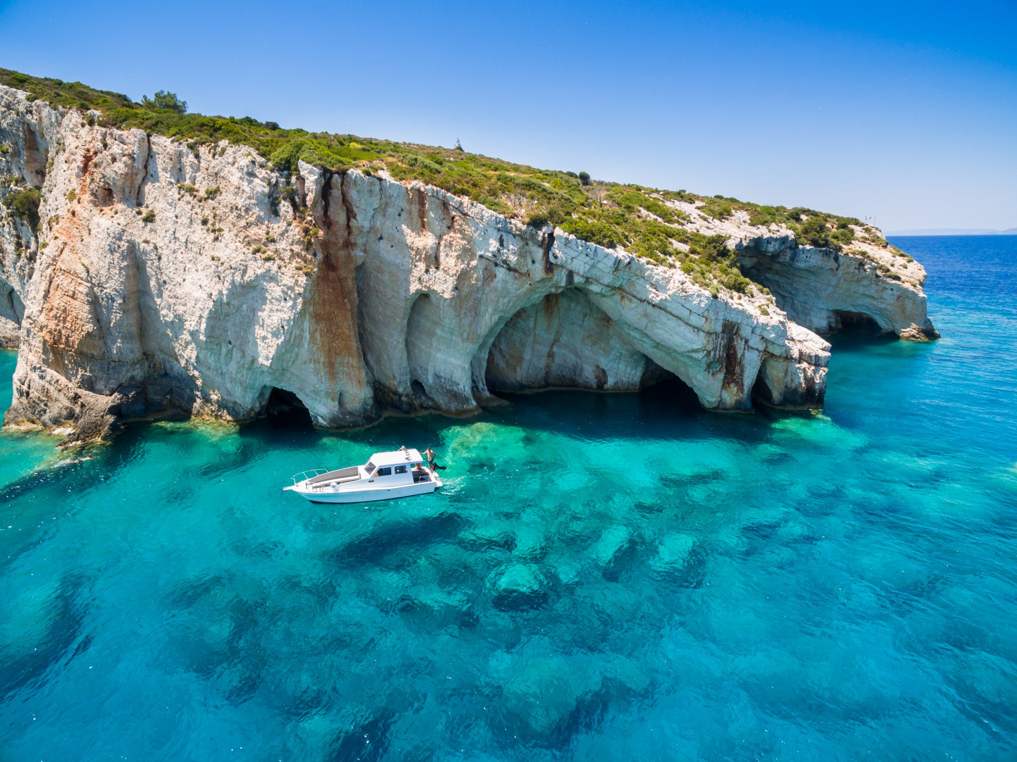Aerial view of Agios Nikolaos blue caves in Zakynthos (Zante) island in Greece