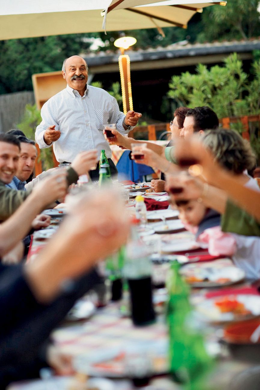 Family Having Banquet Dinner --- Image by   Royalty-Free/Corbis