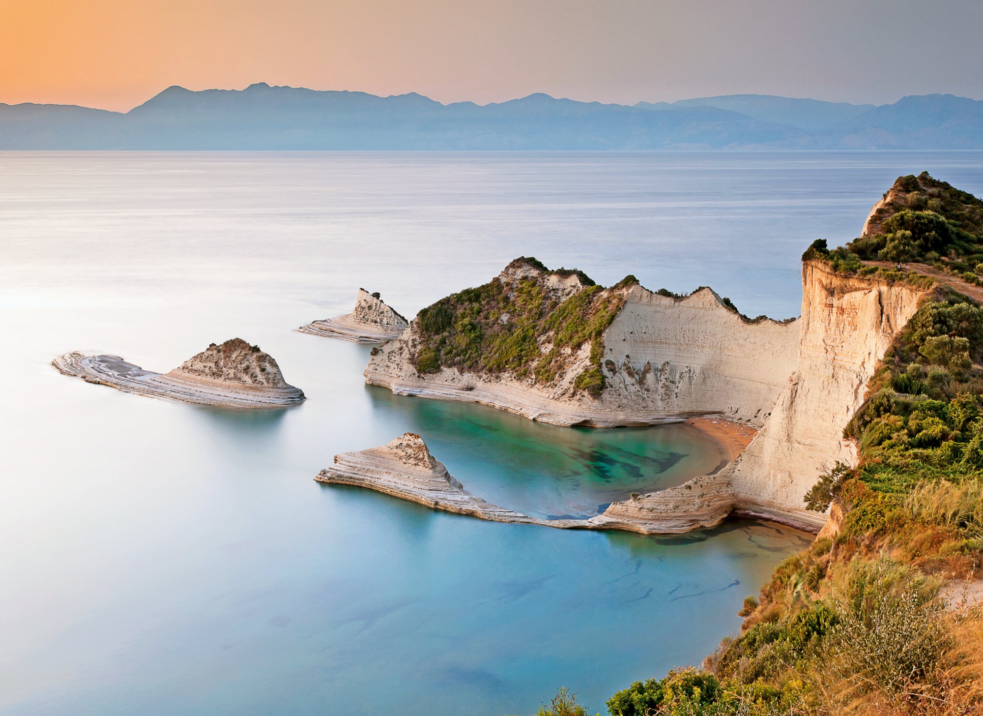 Cape Drastis at sunset, Corfu island, Greece