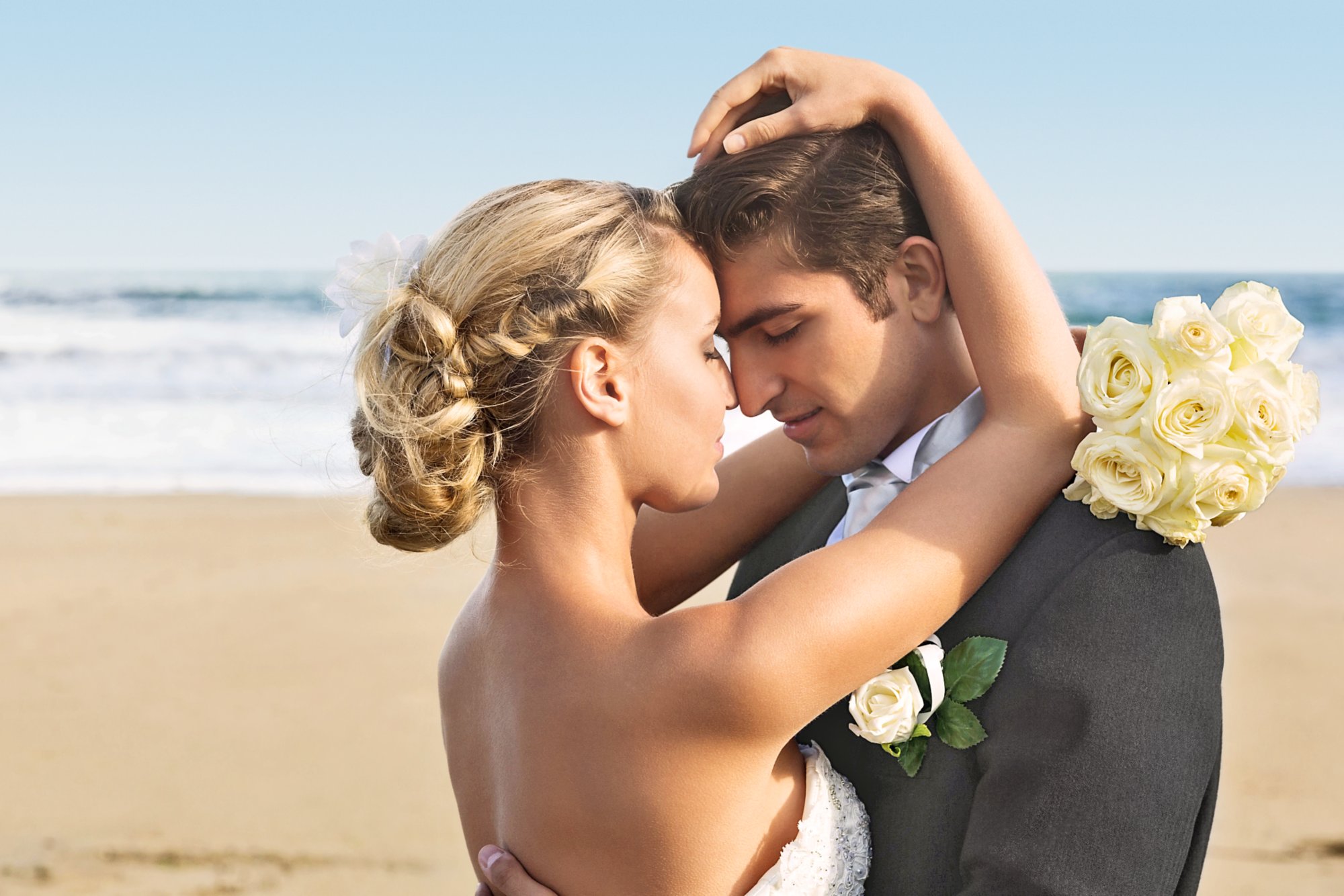 Calm lovely young newlyweds embracing