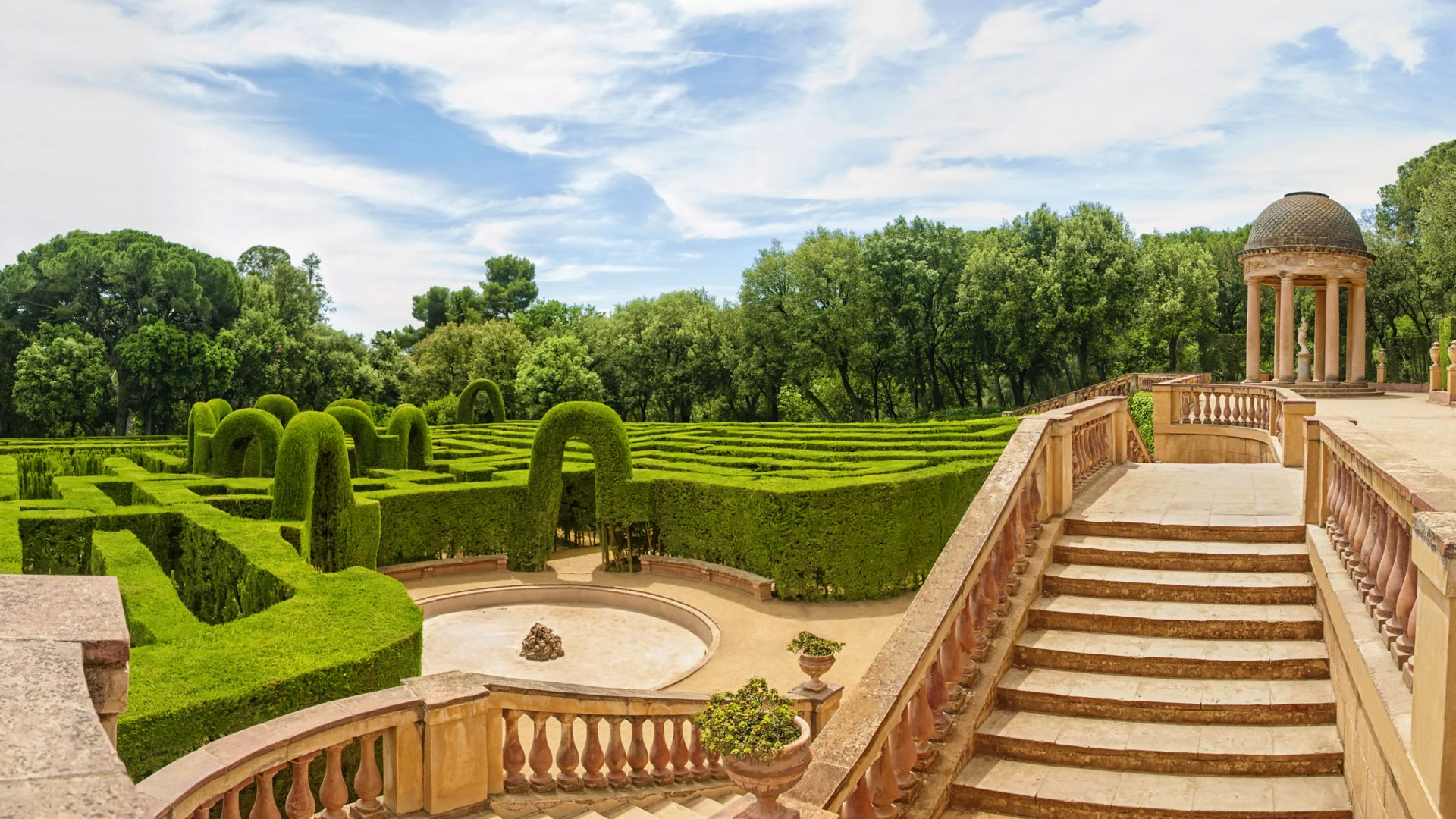 horizontal panoramic view of Labyrinth Park of Horta on sunny summer day, Barcelona, Catalonia, Spain