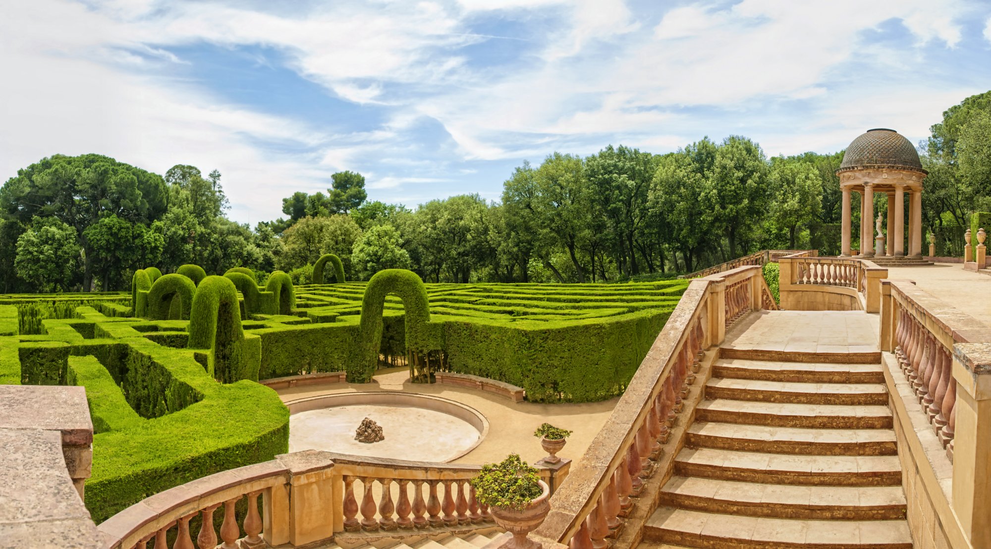 horizontal panoramic view of Labyrinth Park of Horta on sunny summer day, Barcelona, Catalonia, Spain