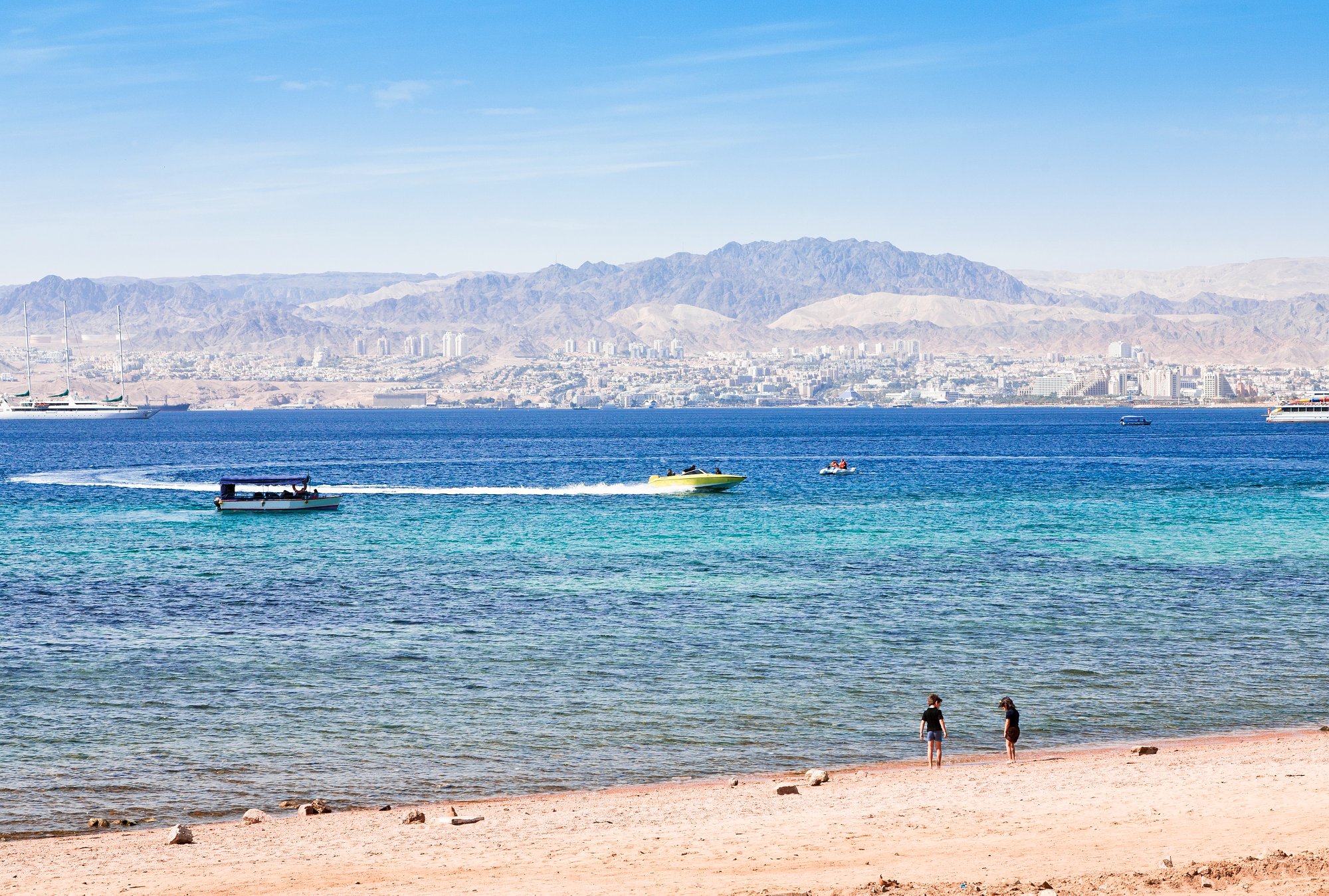 13369828 - municipal aqaba beach and view on eilat town from jordan