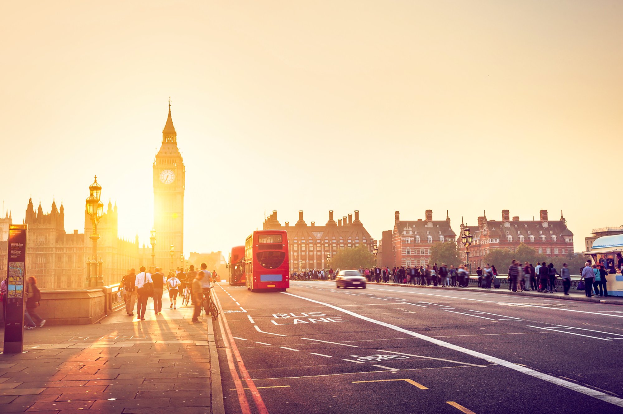 people on Westminster Bridge at sunset, London, UK