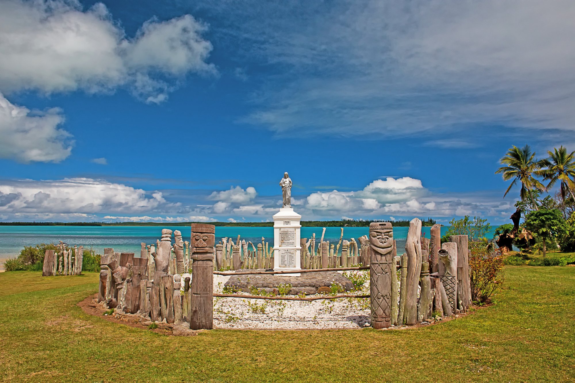 A memorial to European Missionaries on Isle Of Pines, with carved totems