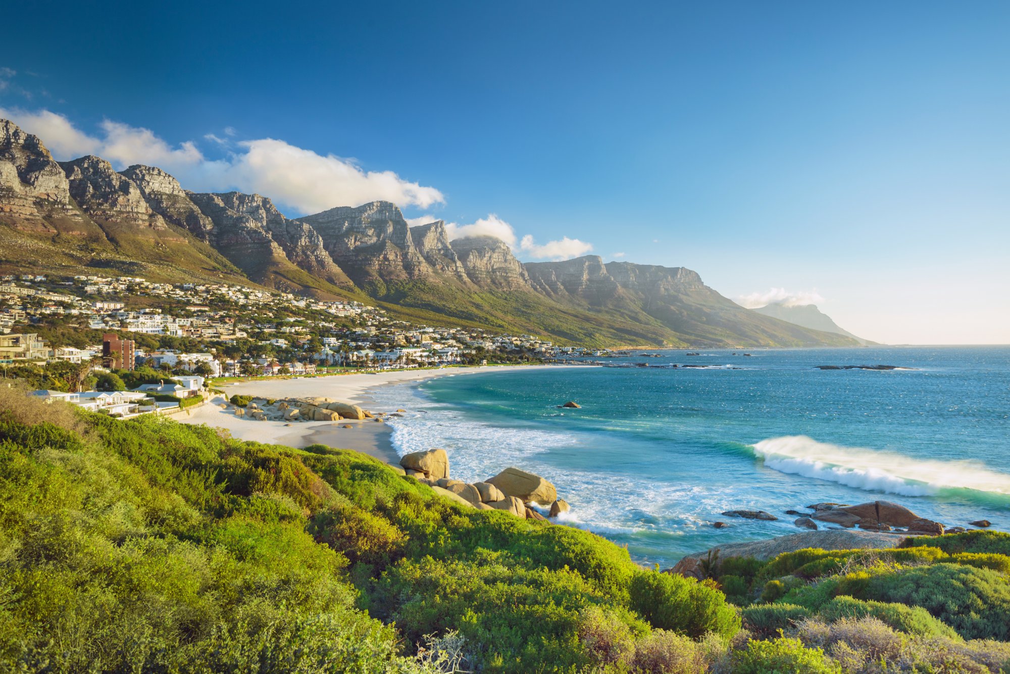 Beach and Twelve Apostles mountain in Camps Bay near Cape Town in South Africa.
