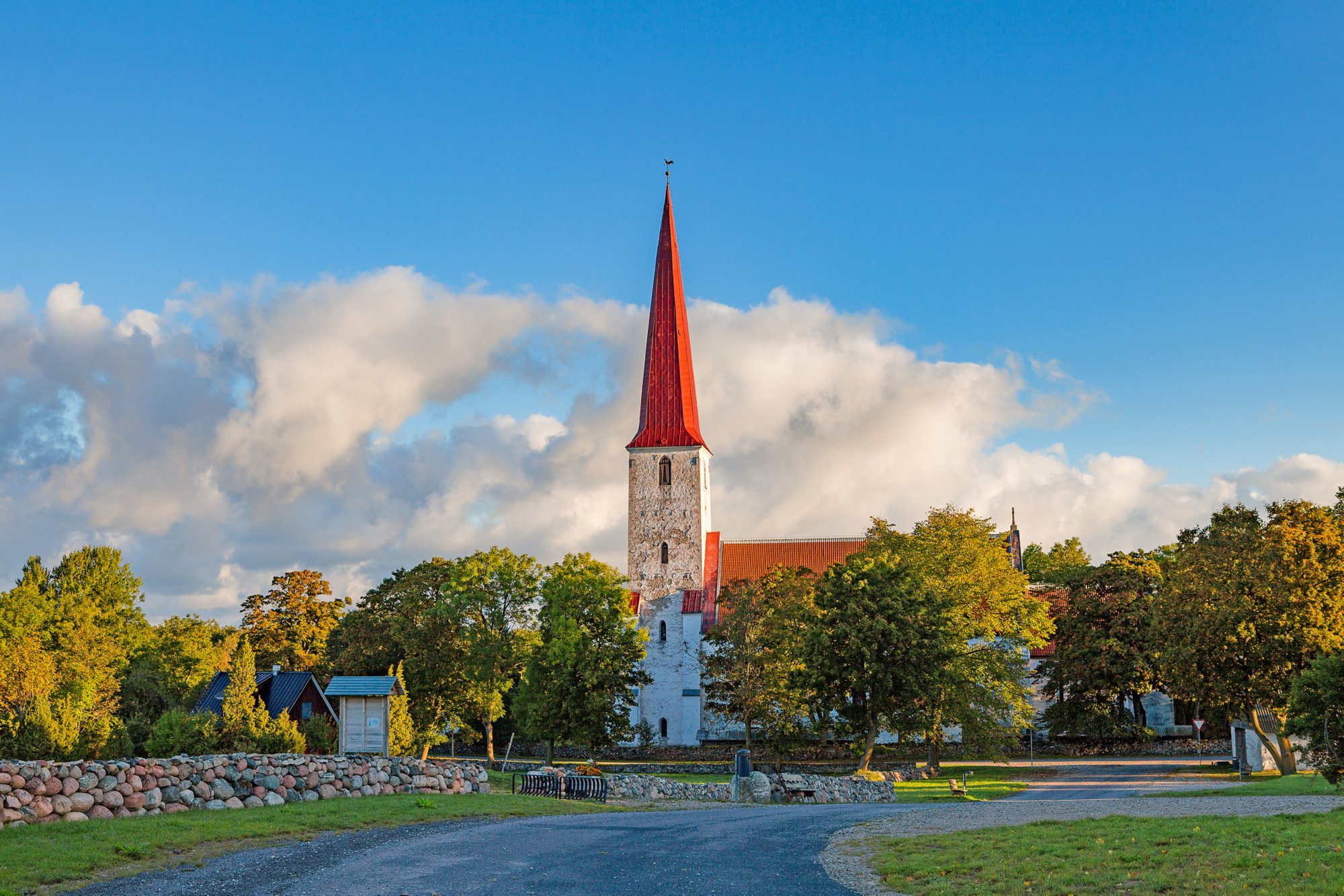 Ancient Lutheran church in Kihelkonna, Saaremaa, Estonia. Early autumn sunny day. Landscape view.