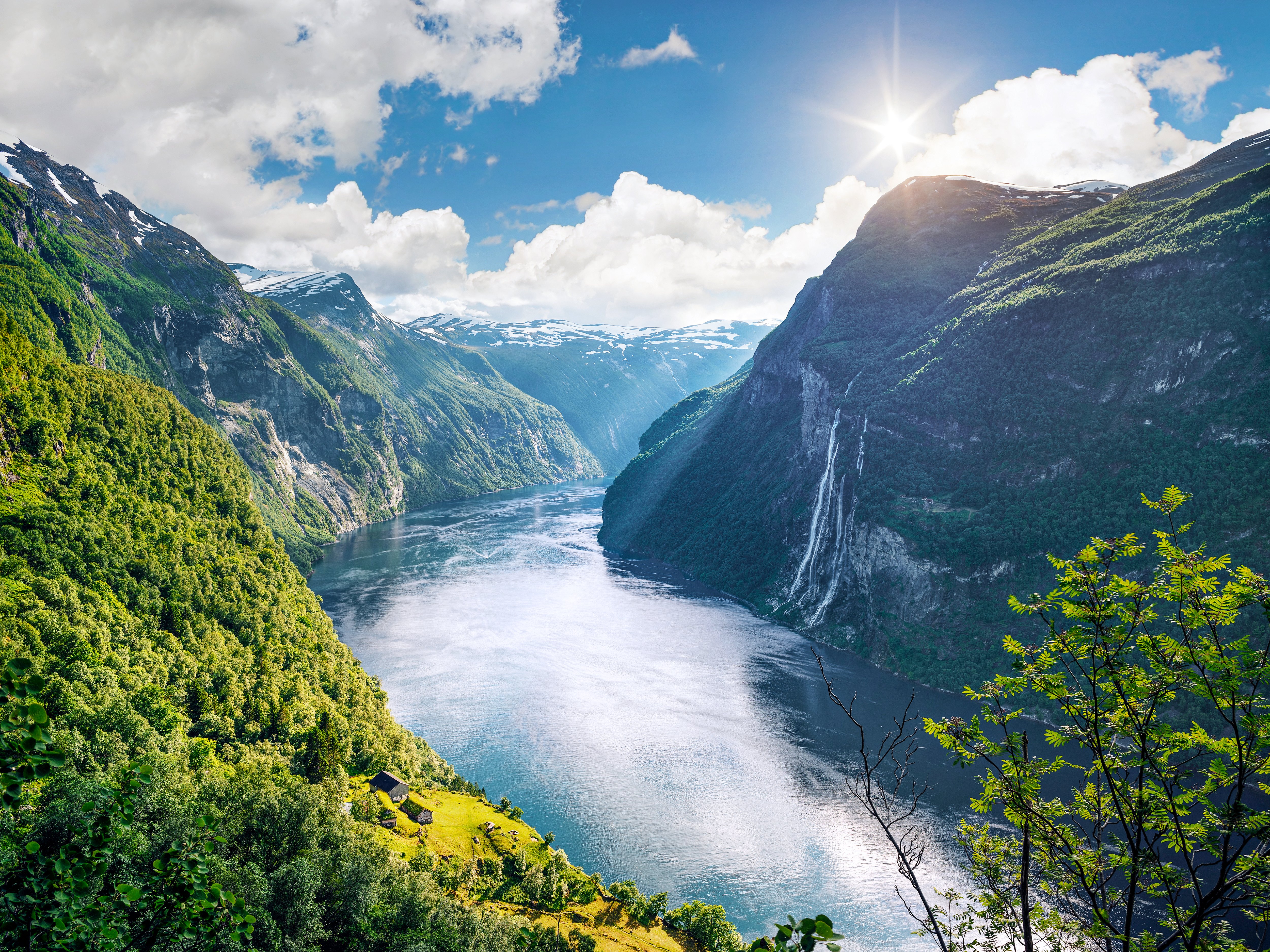 Geirangerfjord fjord. View of the old mountain farm and the Seven Sisters waterfall, Norway. Popular tourist attraction near the city of Geiranger