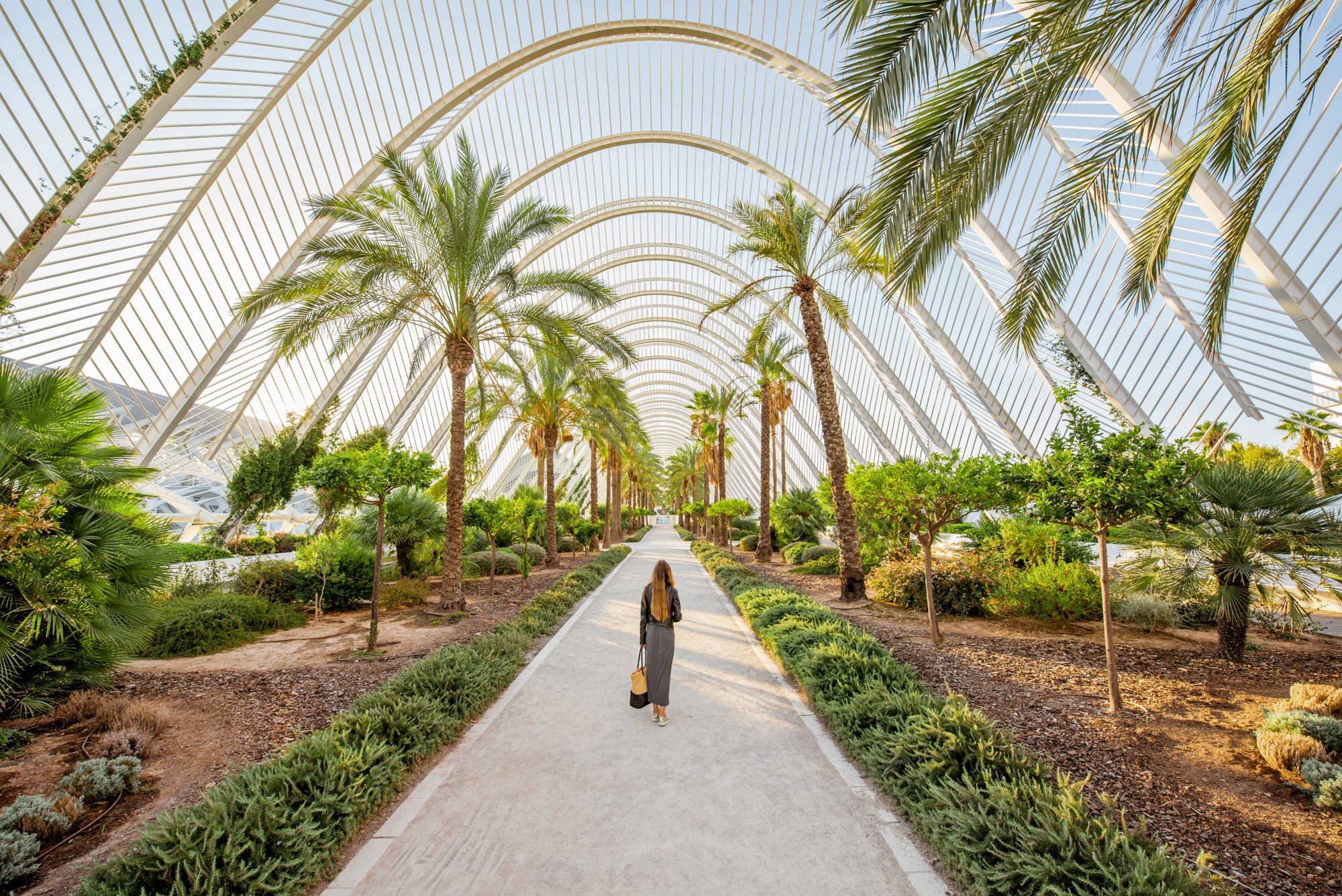 View on the modern park with woman walking in Valencia city, Spain