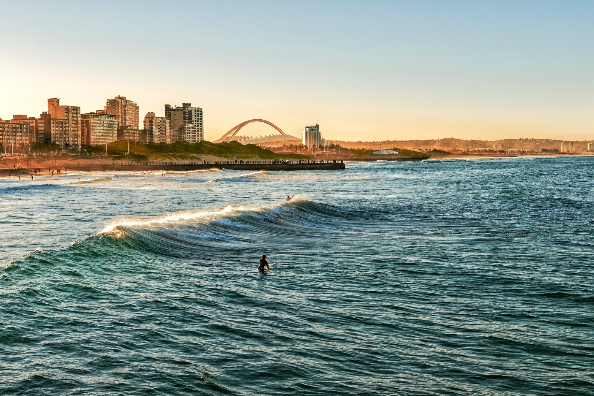 Surfers Enjoying the Waves at Sunset, Durban, South Africa