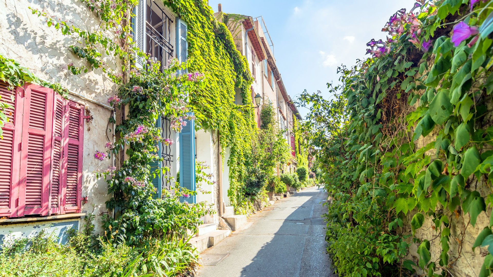 Antibes, France - July 01, 2016: day view of typical narrow street in Antibes, France. Antibes is a popular seaside town in the heart of the Cote d'Azur.