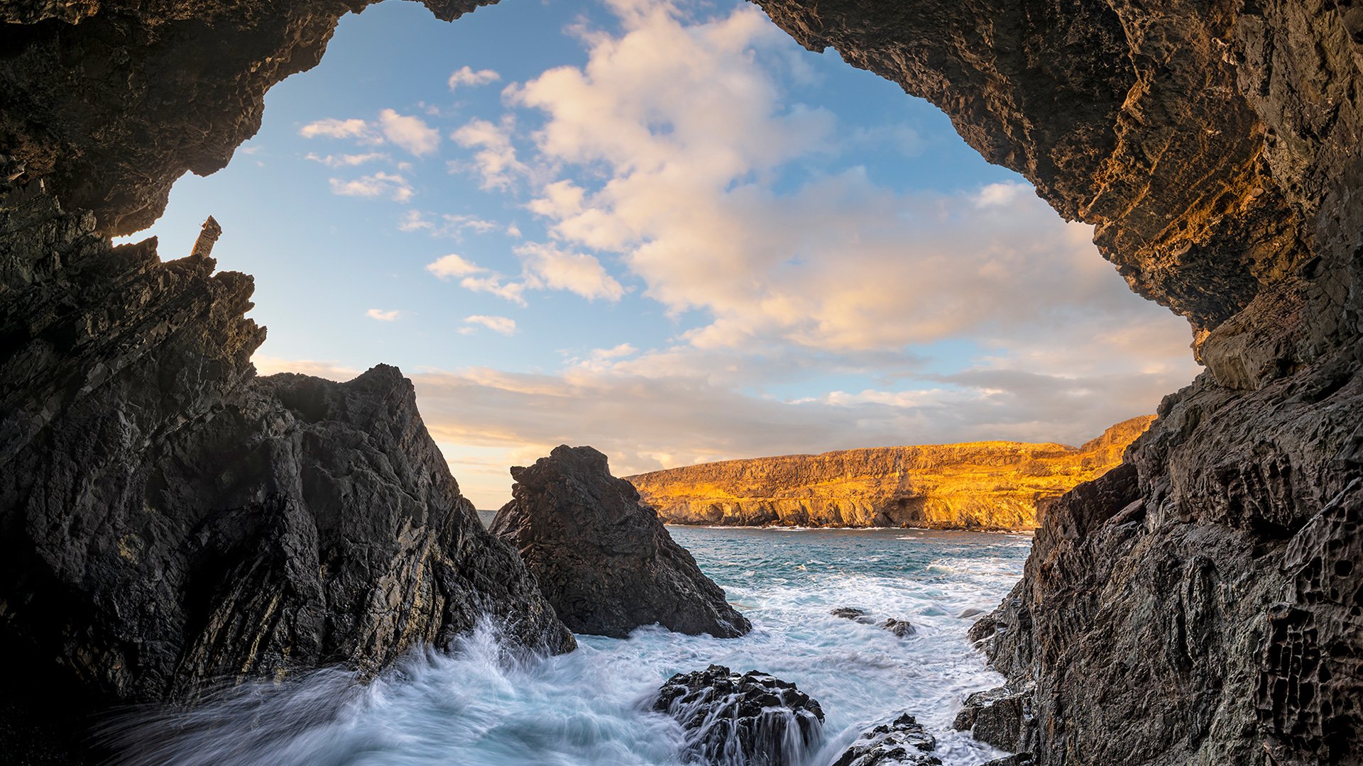 Caves at the ocean cliff in Monumento Natural de las Cuevas de Ajuy National Park